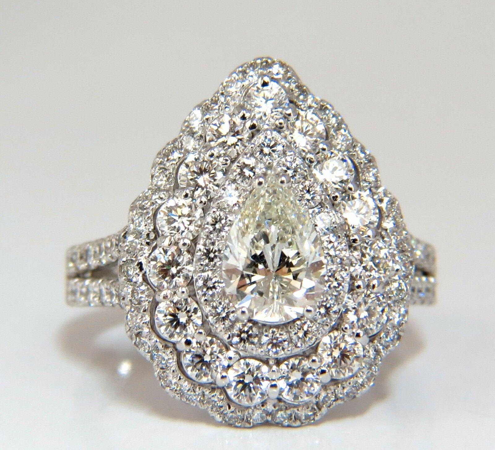 GIA Certified Diamond Ballerina cluster ring.

.82ct. Natural Pear Shape diamond

H color Vs-1 clarity 

Please see report copy attached: #5172482848

Natural Side diamonds: 

Rounds, 1.80ct 

G-color, Vs-2 Clarity.

14kt. white gold.

Ring size: