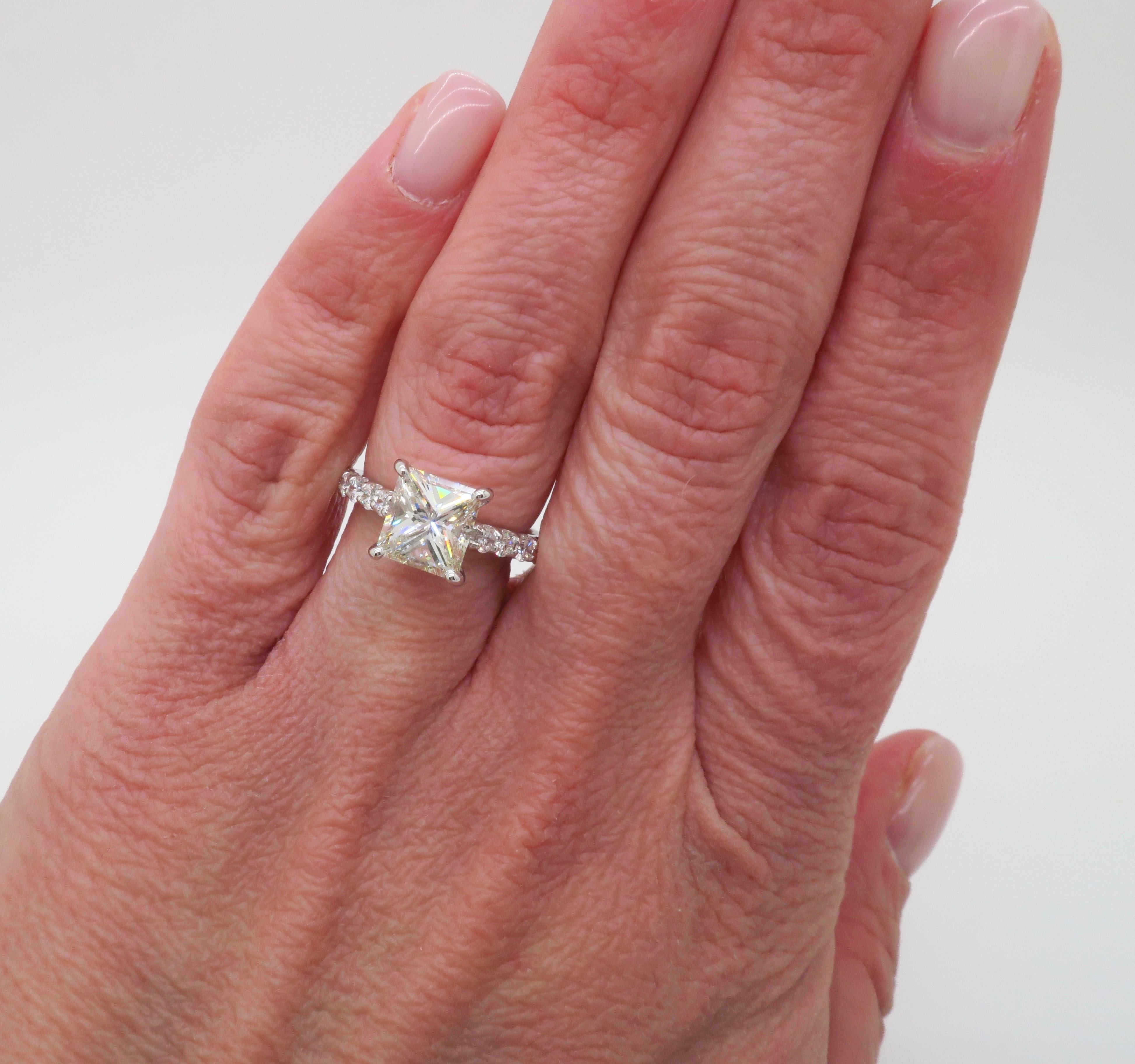 GIA Certified 2.62ct Princess cut diamond ring made in 14k white gold. 

Center Diamond Carat Weight: 2.02CT 
Center Diamond Cut: Princess 
Center Diamond Color: J
Center Diamond Clarity: SI1
Certification: GIA - 2235226030
Total Diamond Carat