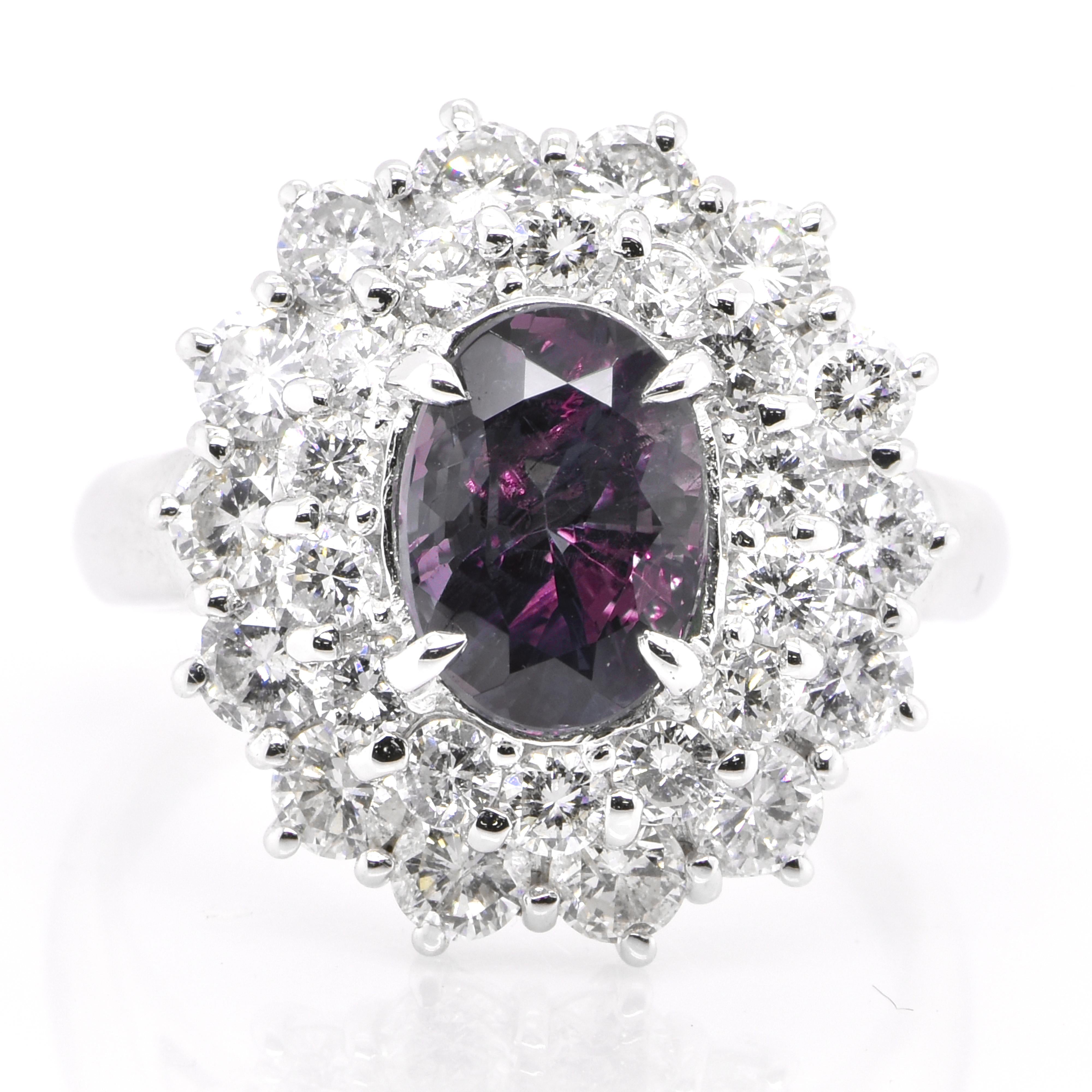 A gorgeous ring featuring a GIA Certified 2.63 Carat, Natural Brazilian Alexandrite and 1.96 Carats of Diamond Accents set in Platinum. Alexandrites produce a natural color-change phenomenon as they exhibit a Bluish Green Color under Fluorescent