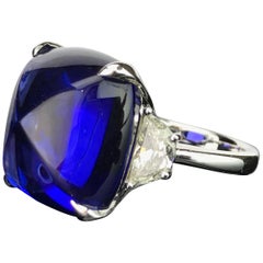 GIA Certified 26.32 Carat Sugarloaf Tanzanite and Diamond Three-Stone Ring