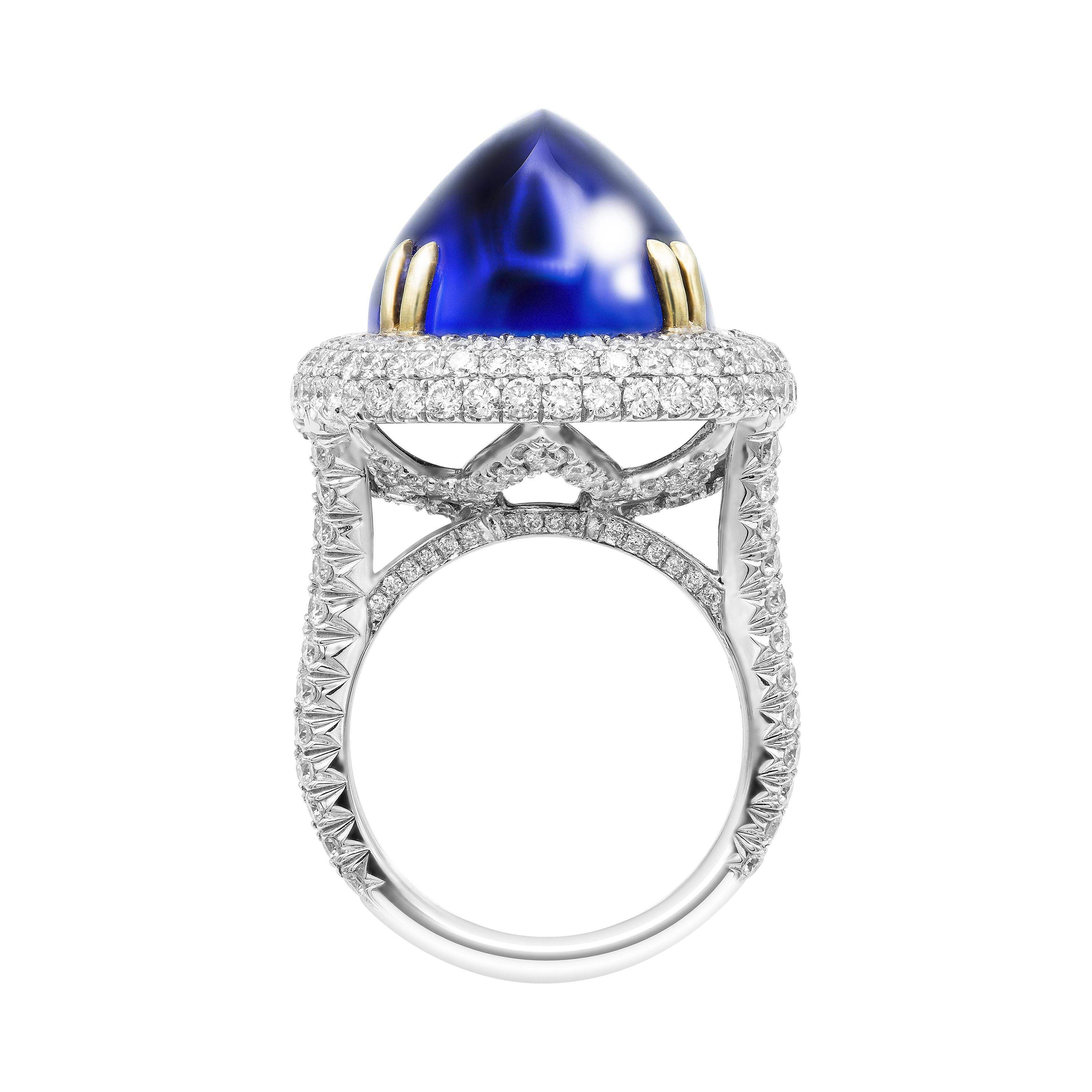 GIA Certified 26.37 Carat Oval Tanzanite Cabochon Diamond Cocktail Ring
Crafted in 18K White Gold & 18K Yellow Gold prongs

Size 6 (can be sized)

A Exceptional Handmade Statement piece, 18k White Gold High-Domed , 
