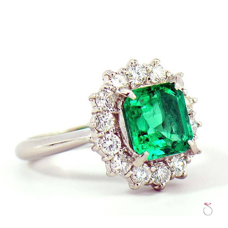 Natural Colombian Emerald & Diamond Halo ring is just stunning. The ring features a 2.64 carat natural square Emerald  cut in the center Surrounded by a beautiful diamond halo. The 2.64 carat center Colombian Green Emerald is accompanied by GIA
