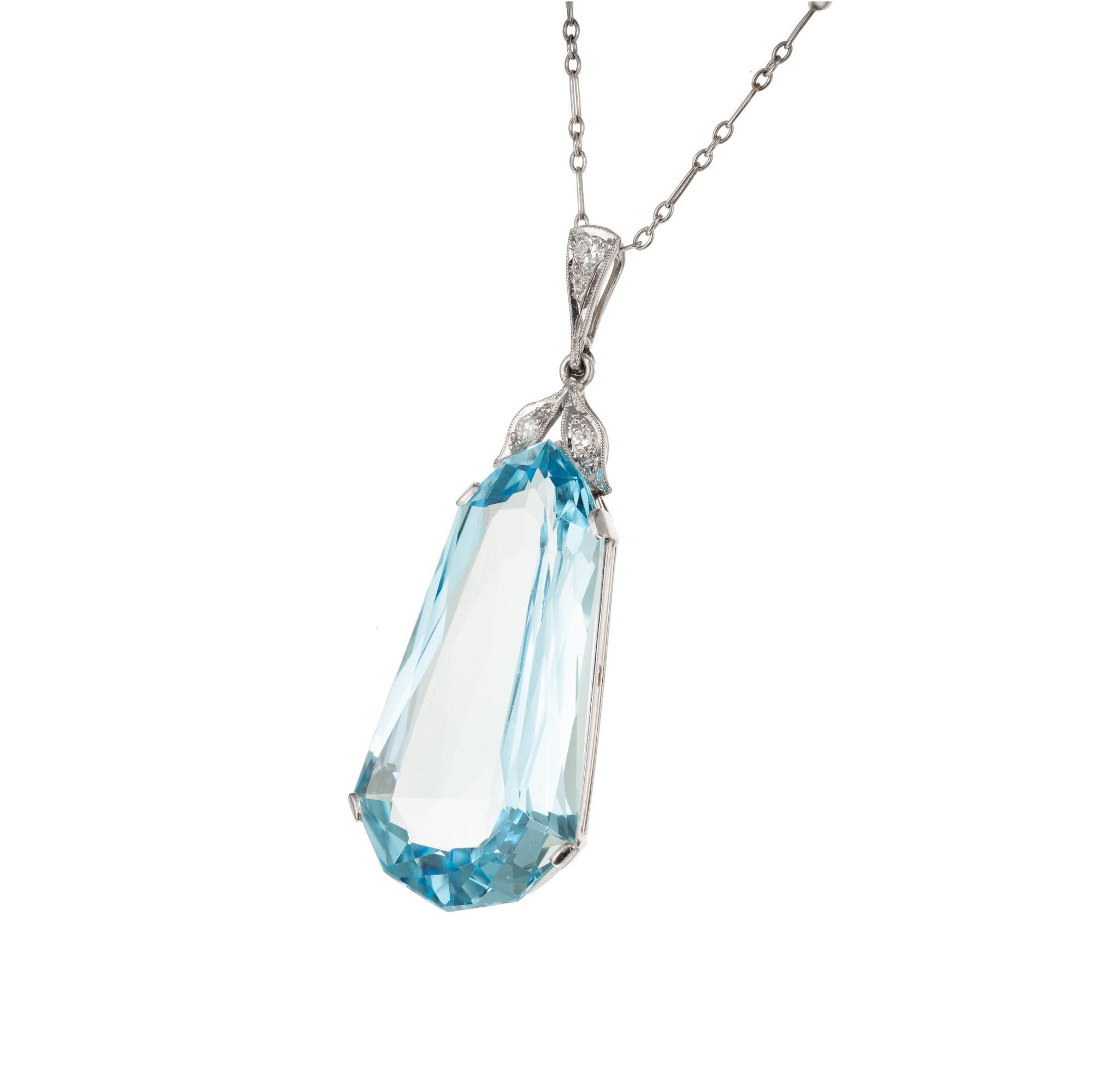26.49 carat natural aquamarine sits in a vintage platinum setting accented with round diamonds, suspended on a 16 Inch open link platinum chain. All original Art Deco circa 1920's. GIA certified.

1 modified pear brilliant cut blue aquamarine,