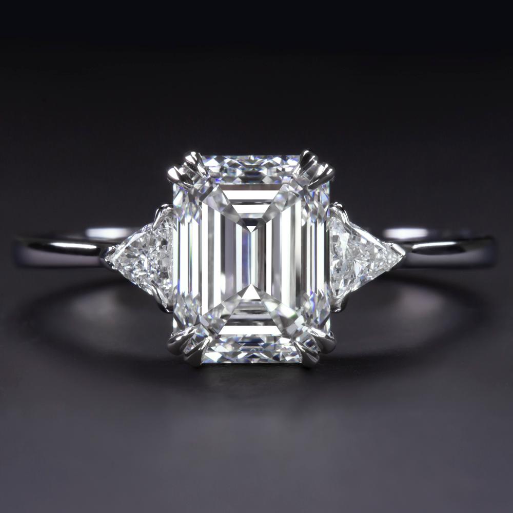 The main stone is an amazing quality Gia Certified 2 Carat Emerald Cut Diamond

