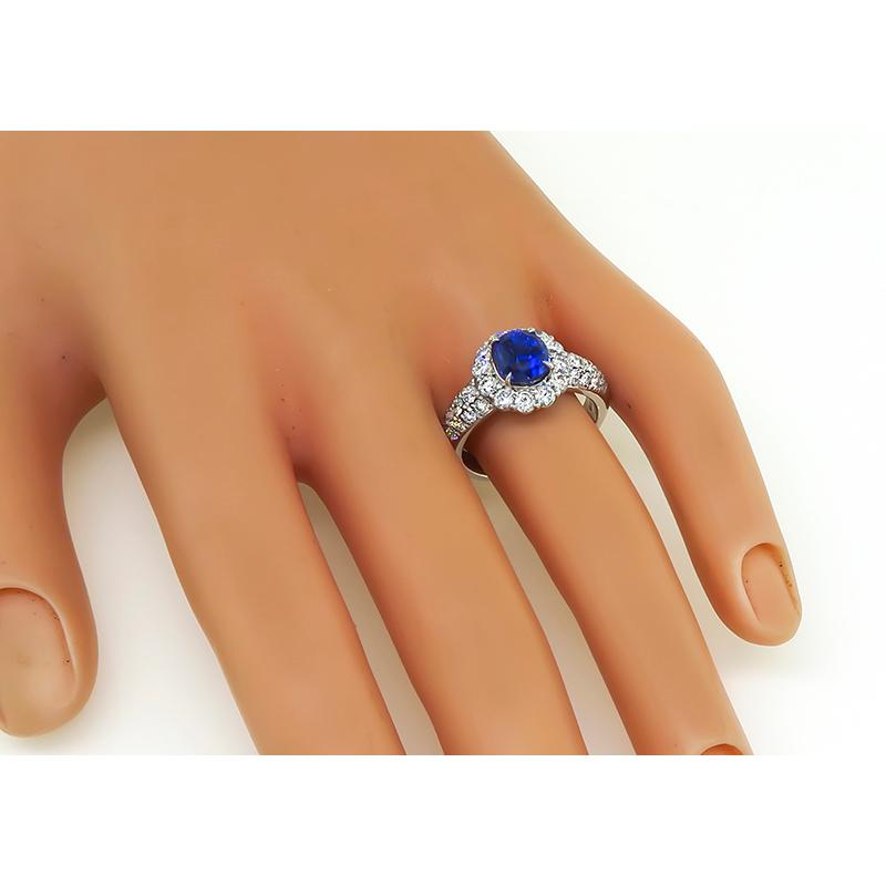 This is an elegant platinum engagement ring. The ring is centered with a lovely GIA certified oval cut no heat Ceylon sapphire that weighs 2.65ct. The center stone is accentuated by sparkling round cut diamonds that weigh approximately 1.22ct. The