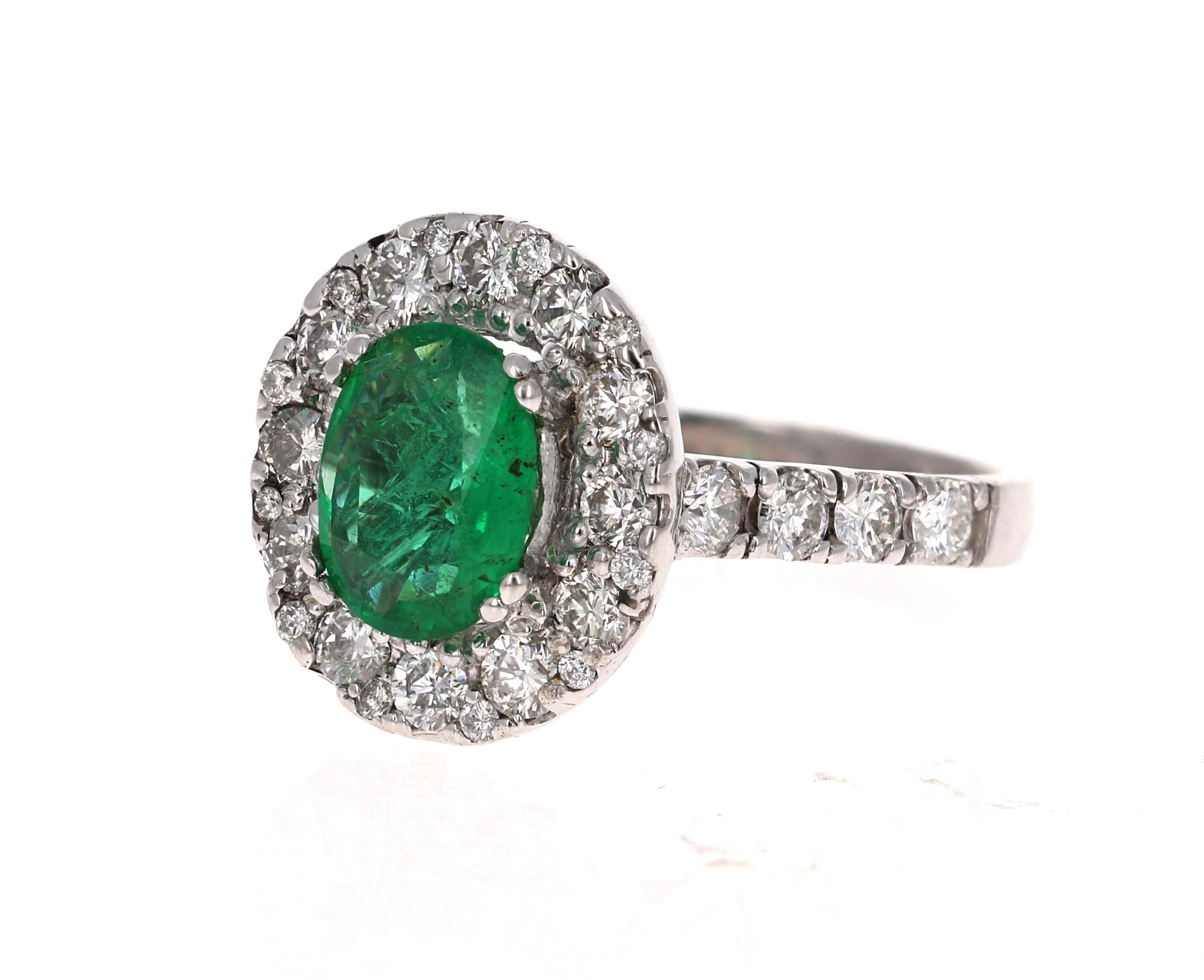 This is a gorgeous, gorgeous, gorgeous Emerald and Diamond Ring!  This 14K White Gold Ring has an Oval Cut Emerald that weighs 1.26 carats and is surrounded by a Halo of 32 Round Cut Diamonds that weigh 1.40 Carats. (Clarity: SI1, Color: F).  The