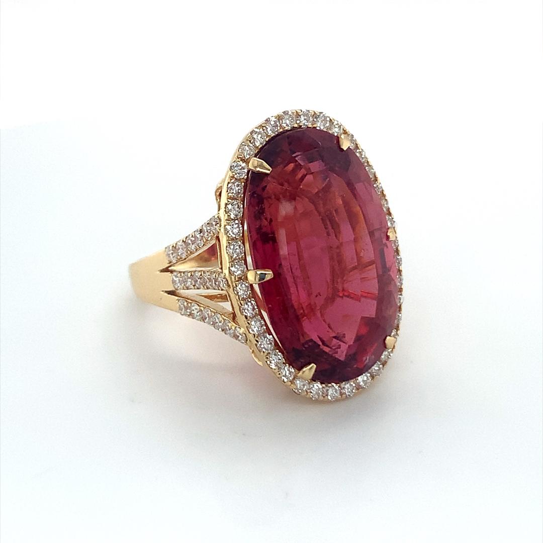 20.30 Carat Purplish Red Oval Rubellite with Diamond set in 18 Kt yellow gold