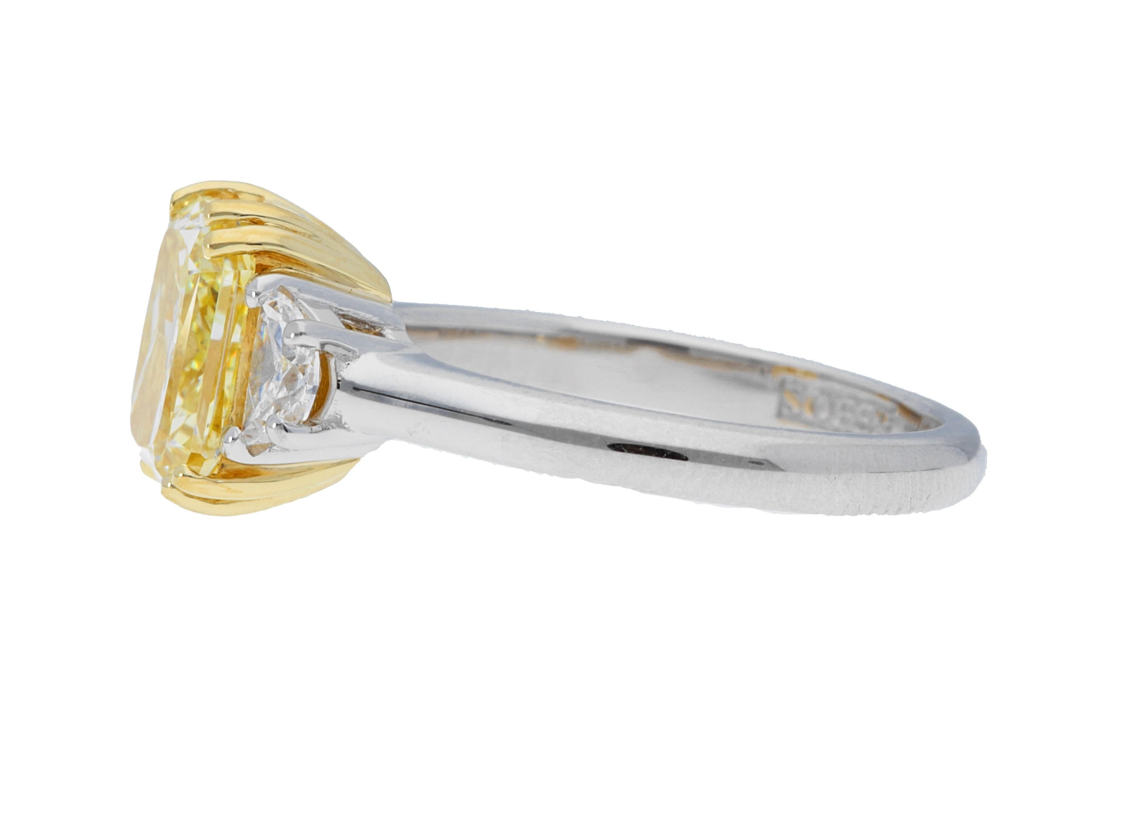 Contemporary GIA Certified 2.67 Carat Fancy Yellow Radiant Diamond Three Stone Ring