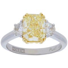 GIA Certified 2.67 Carat Fancy Yellow Radiant Diamond Three Stone Ring