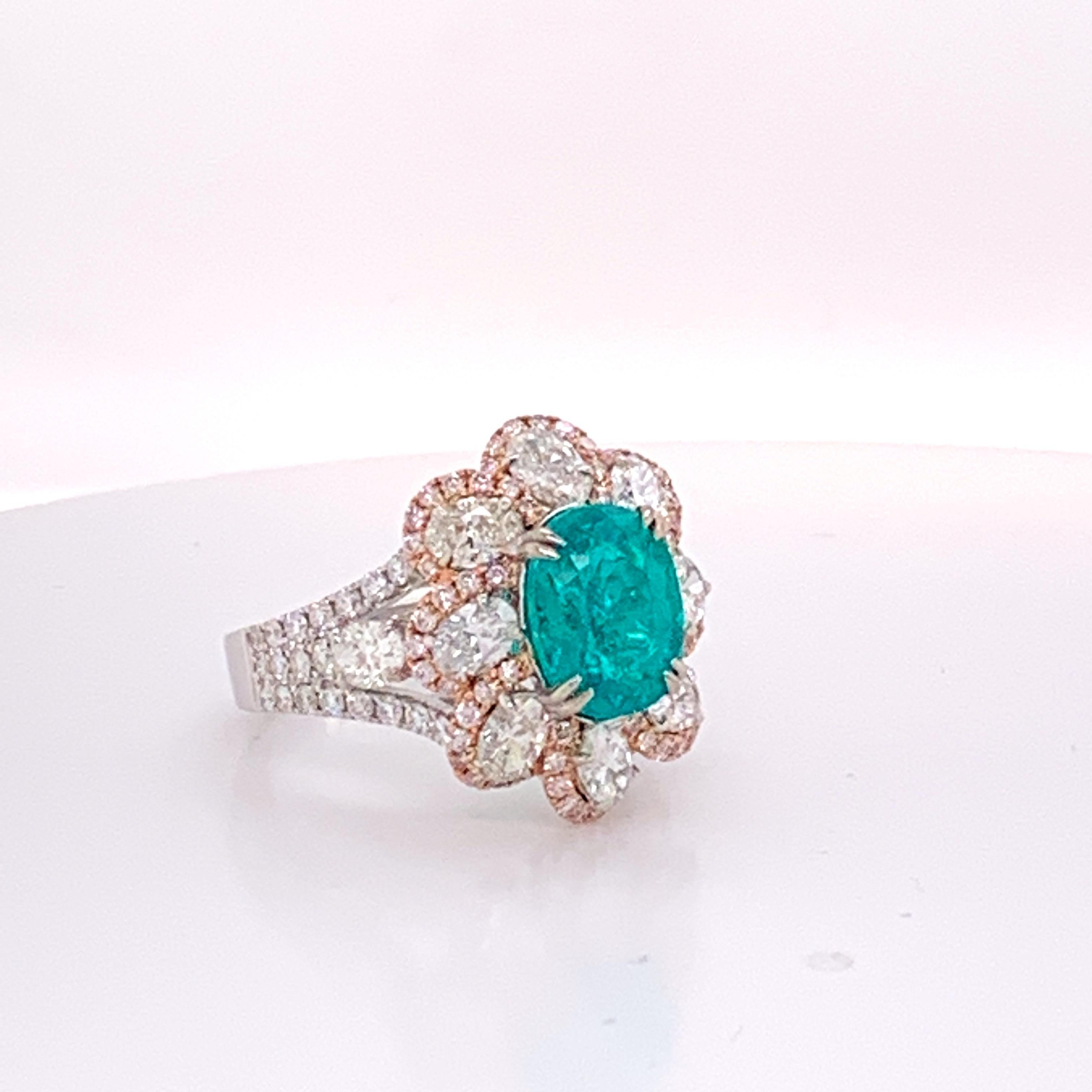 Natural Brazilian Paraiba Region Cooper Bearing swimming pool blue neon blue Tourmaline is well cut oval Stone.
The stone is set with 2.11 Carat White and 0.49 Carat Pink diamonds.The Rng is one of a kind and handcrafted.
The Ring is Sizable 7.