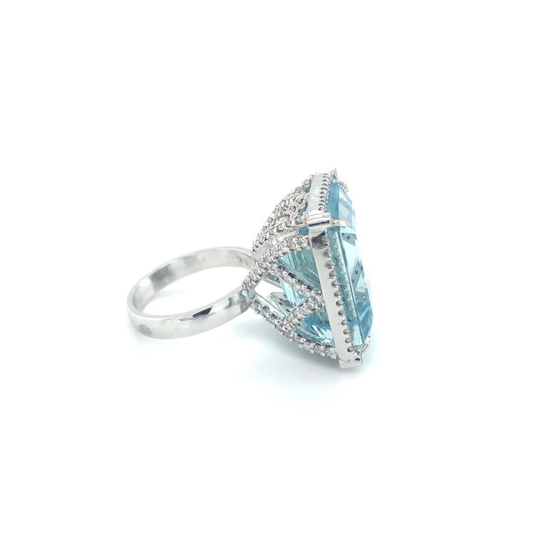 26.71 Carat Natural Brazilian Aquamarine Ring with Diamonds set in 18 Kt White gold 