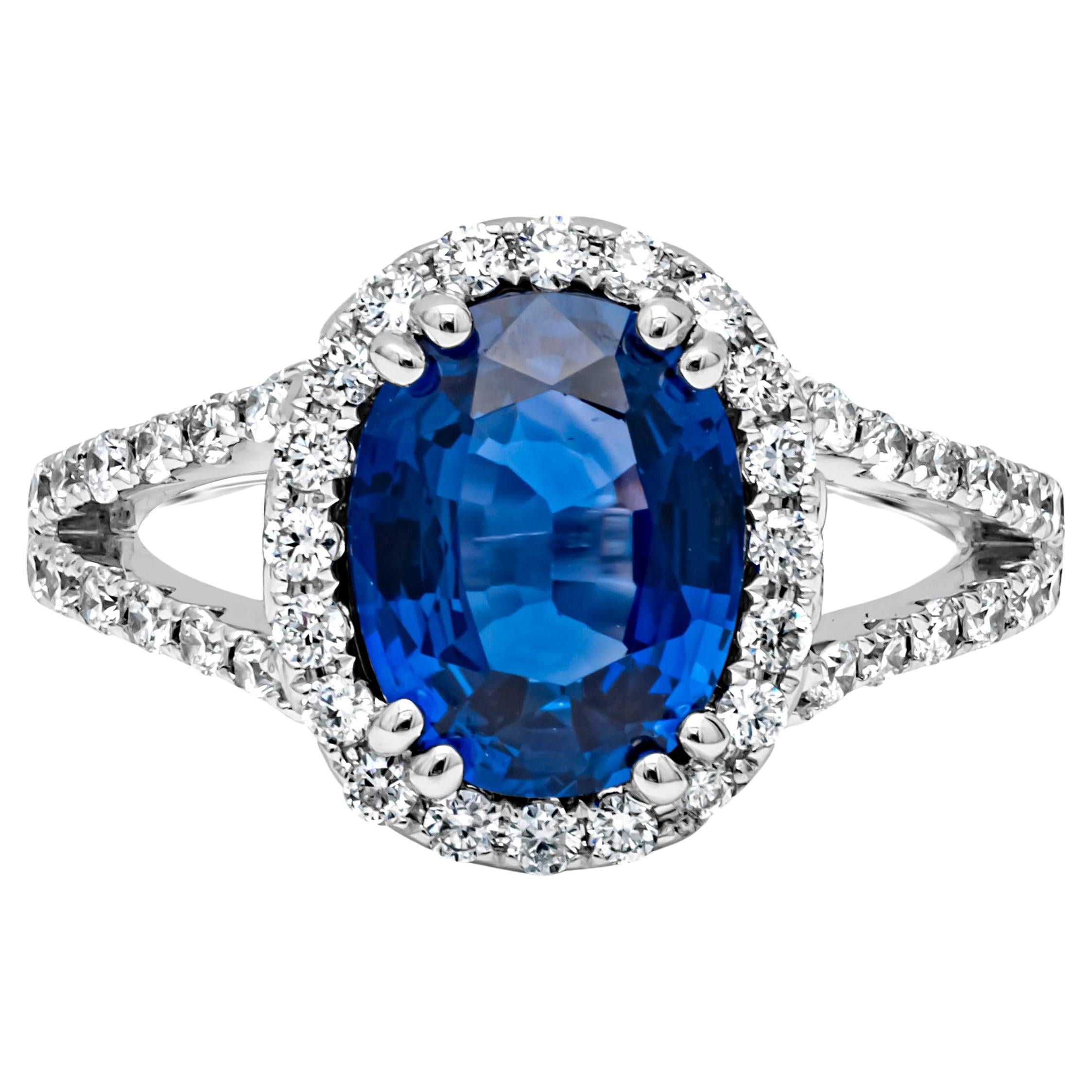 GIA Certified 2.68 Carat Oval Cut Heated Sri Lanka Sapphire Halo Engagement Ring For Sale