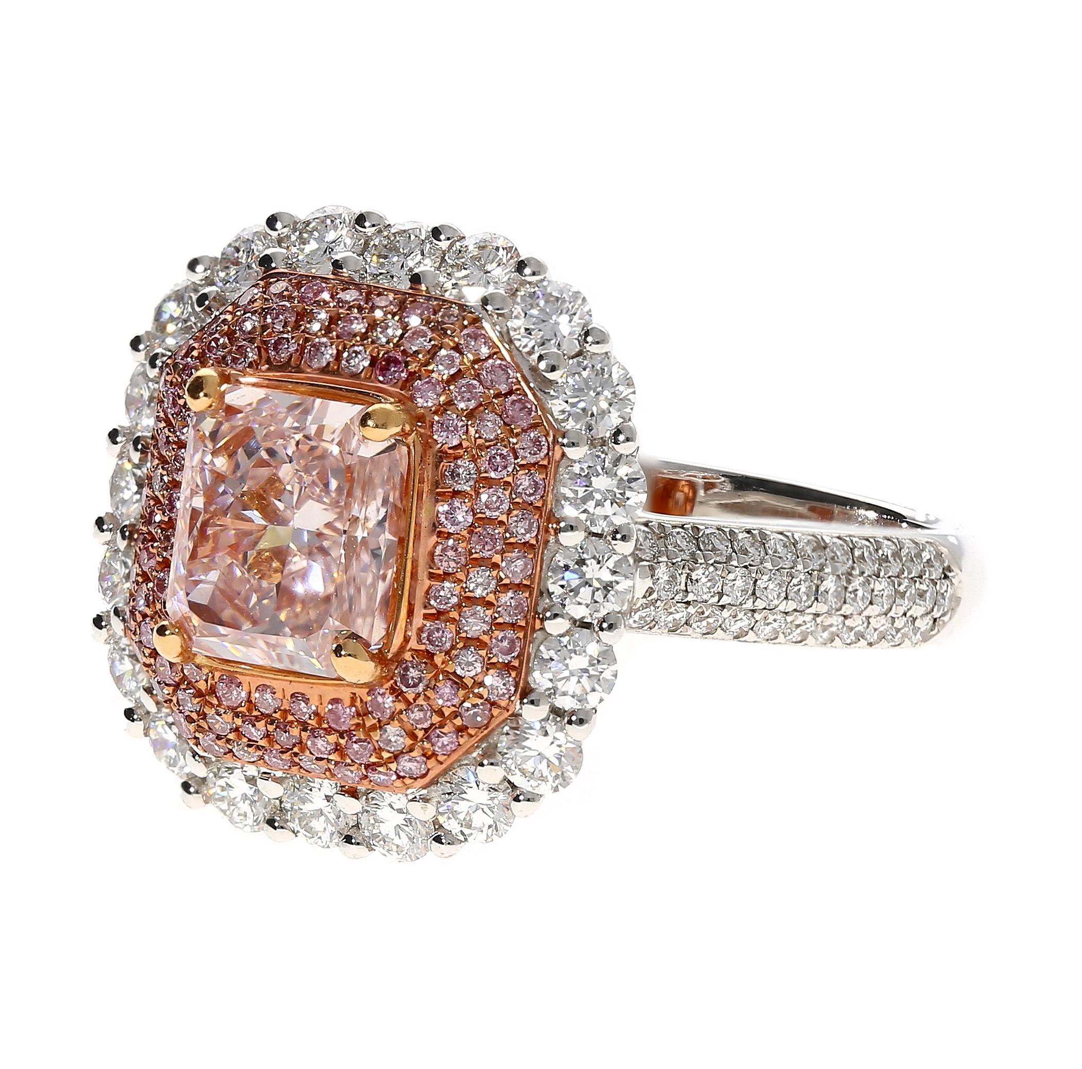 GIA certified radiant cut 1.50 carat fancy light orangey pink diamond center stone adorned with multiples rows of pink and white round cut diamonds. Set in 18k white gold. The center stone bears a natural color origin, even distribution, and nearly