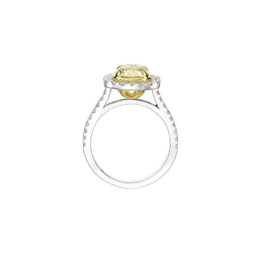 This magnificently beautiful and very rare 2.71 ctw cushion cut diamond engagement ring will astonish you with its exceptional color, quality and brilliance! The exceptional 2.21 ct cushion cut diamond set in the center is GIA certified at Fancy