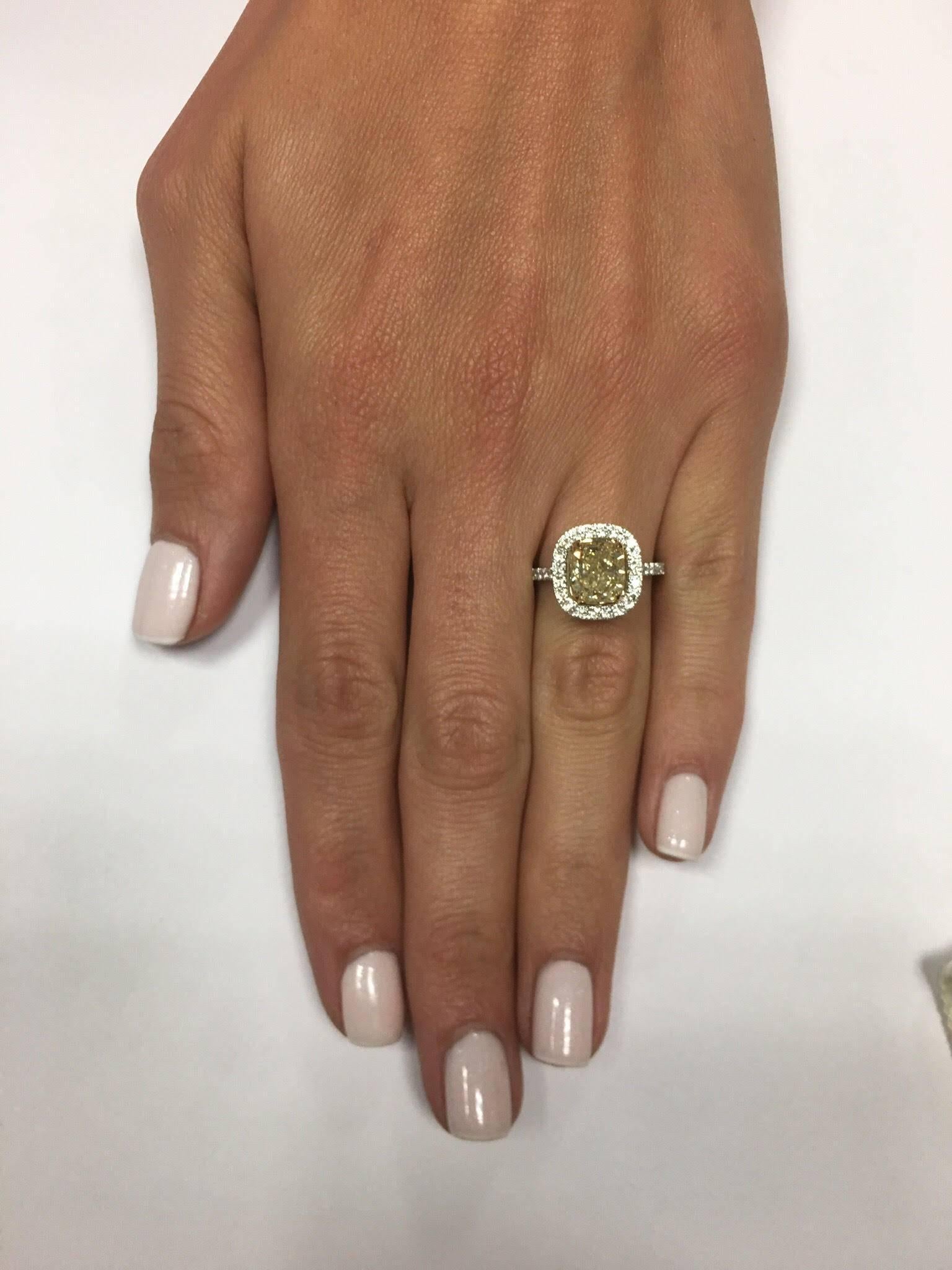 GIA Certified 2.71 Carat Fancy Yellow Cushion Cut Diamond Halo Engagement Ring In New Condition For Sale In New York, NY
