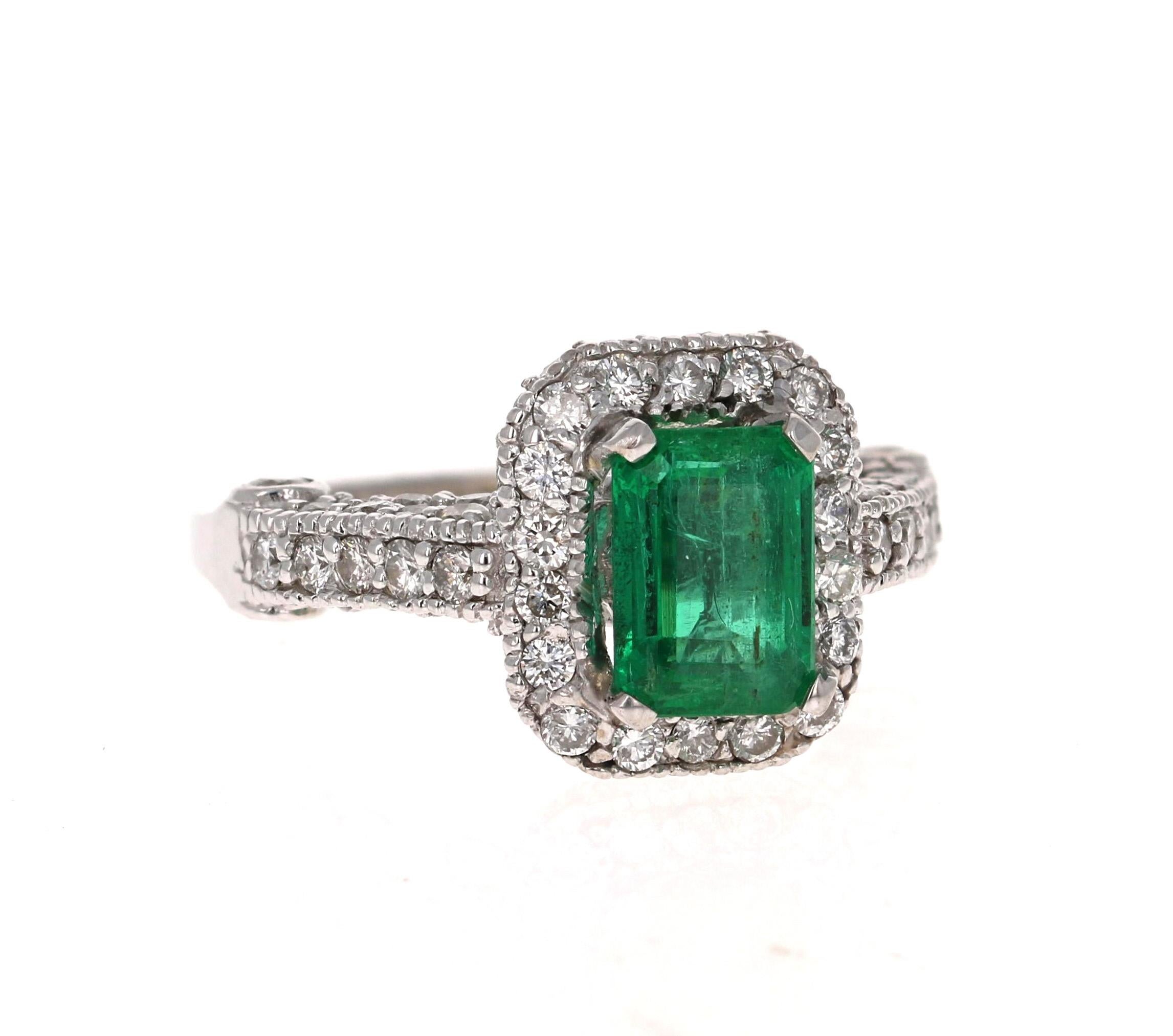 Stunning Vintage Inspired Emerald Cut Emerald Diamond Ring! 

This Emerald ring is absolutely gorgeous. The center is an Emerald cut Emerald which weighs 1.47 carats and measures in at approximately 6 mm x 8 mm.  The Emerald is surrounded by 84