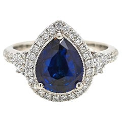 Bague en platine sertie d'un saphir de 2,75 carats certifié par le GIA et d'un diamant « Fancy »