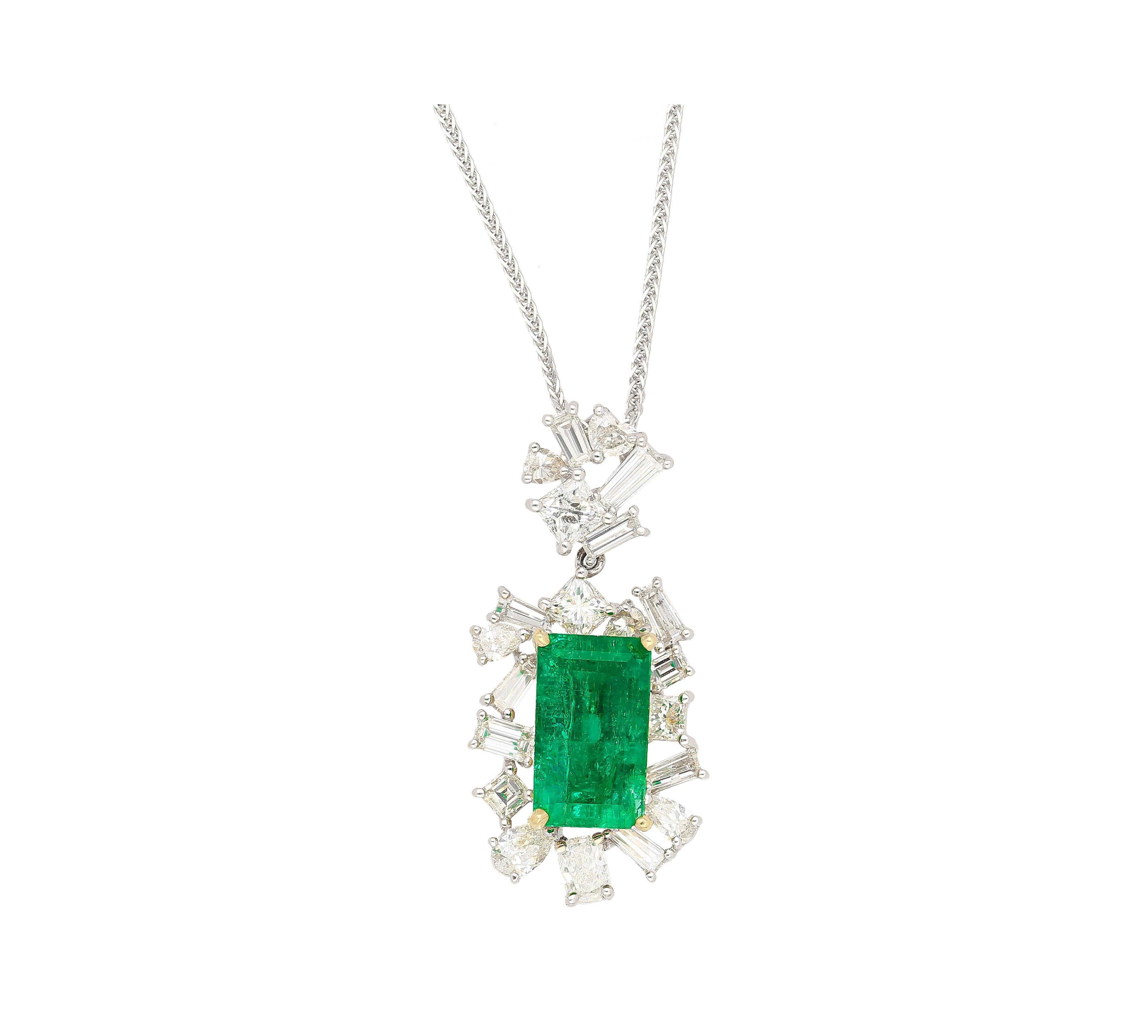 GIA & GRS Certified 2.76 Carat Muzo Mine Minor Oil Colombian Emerald and Diamond Cluster Pendant Necklace. Adorned with a dazzling display of pear, heart, baguette, radiant, emerald and princess cut diamonds. A stunning ensemble of all the major