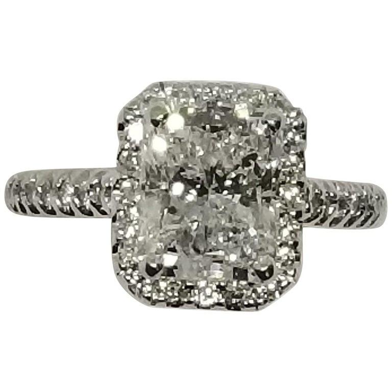 14k white gold diamond engagement ring, containing 1 radiant cut diamond; color 