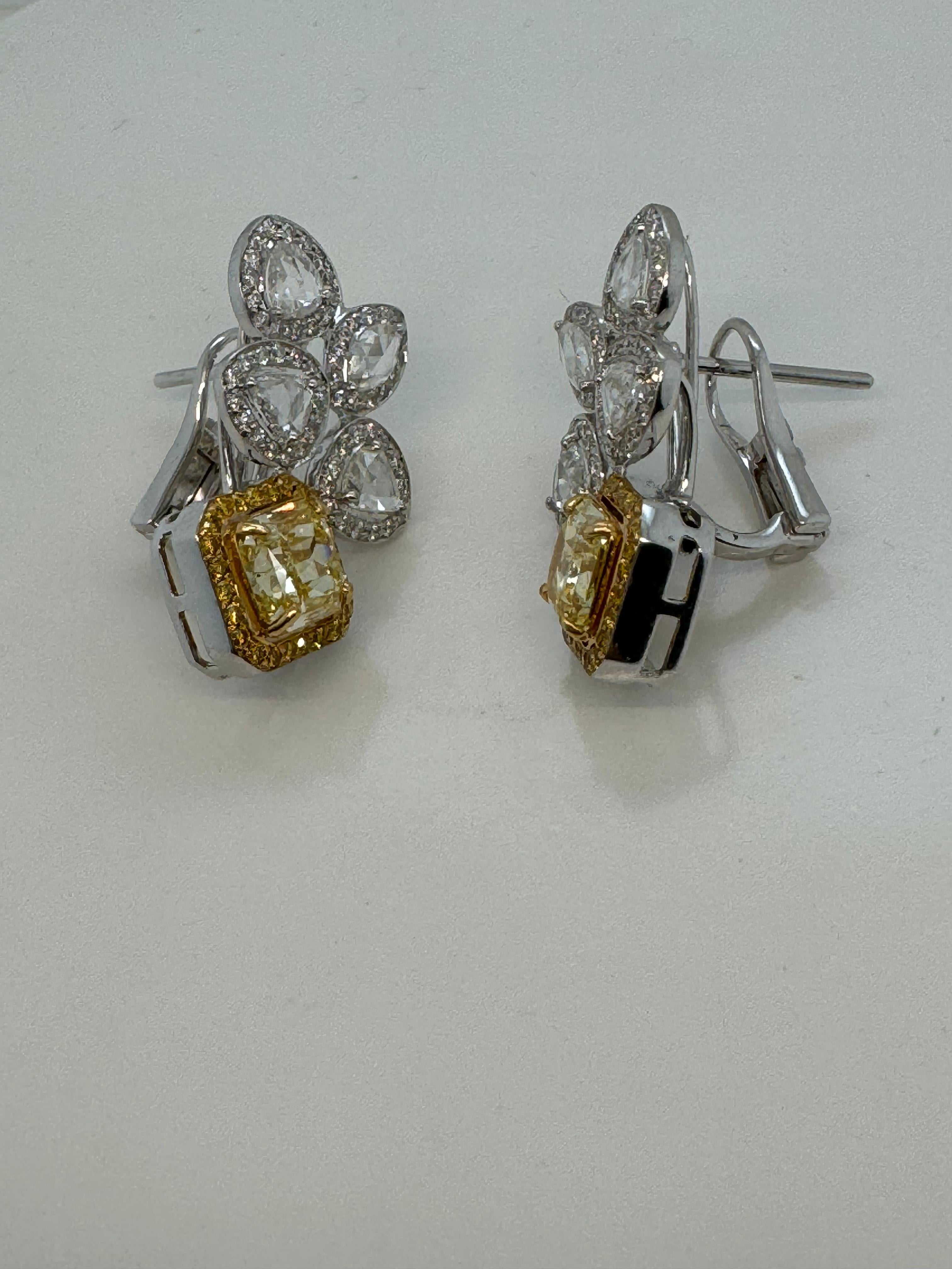 Introducing a breathtaking pair of earrings from Rewa Jewelry, designed to showcase luxury and refined craftsmanship.

At the center of each earring are GIA Certified Fancy Intense Yellow diamonds, weighing 1.51 carats (GIA-6234009151) with VS1