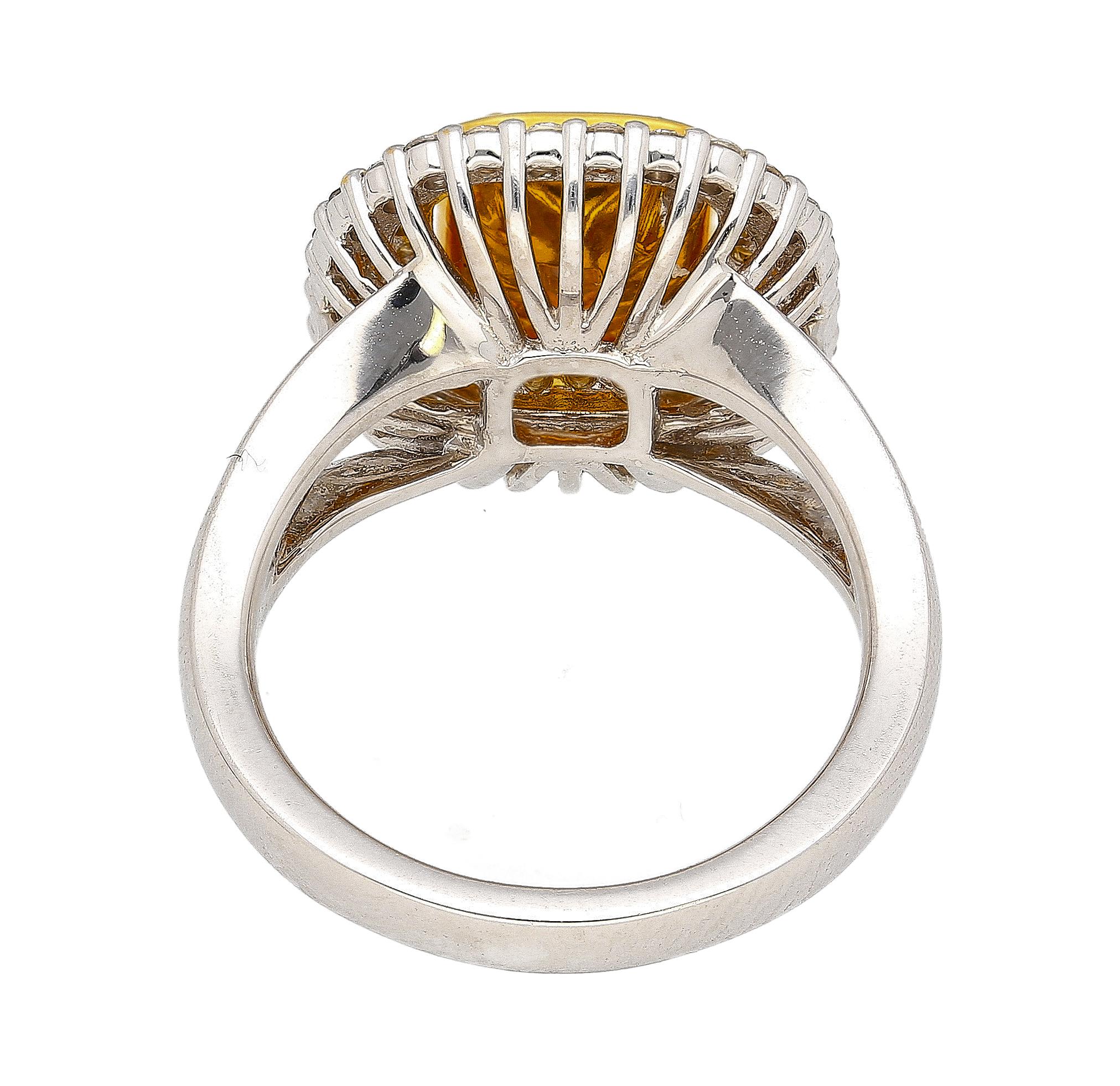 GIA Certified diamond ring. Crafted in two-toned 18K yellow and white gold, this ring boasts a GIA Certified 2.22 carat Fancy Light Diamond center stone with VS1 clarity and even color distribution. Detailed with 28, two-toned - yellow and white -