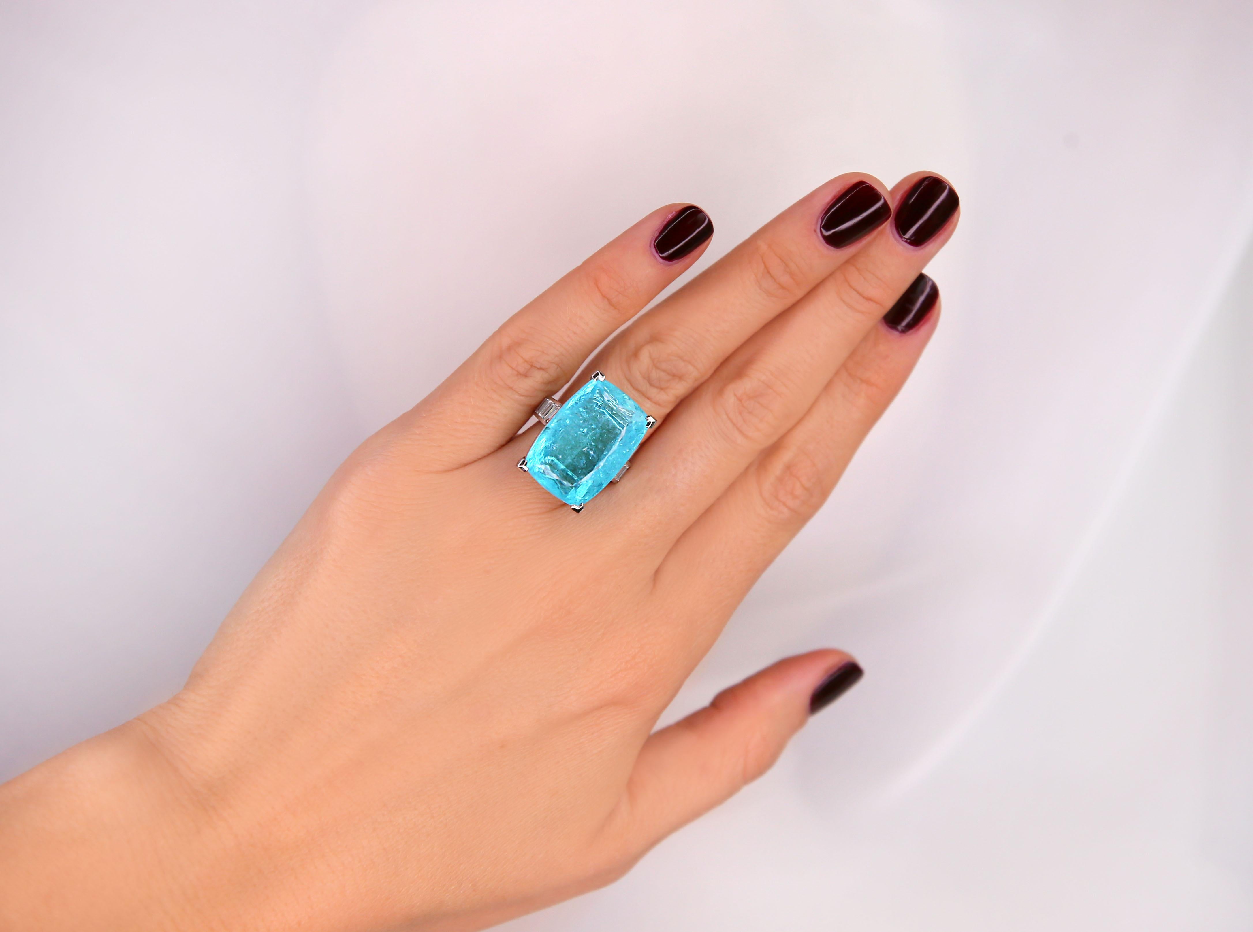 Incredible and unique GIA Certified 27,9 Carat Paraiba Tourmaline Diamond White Gold  Cocktail Ring made by swiss jewellers. 

Impeccable finishing, 10  baguette cut diamonds IF quality  for a total of 1.01 carats



