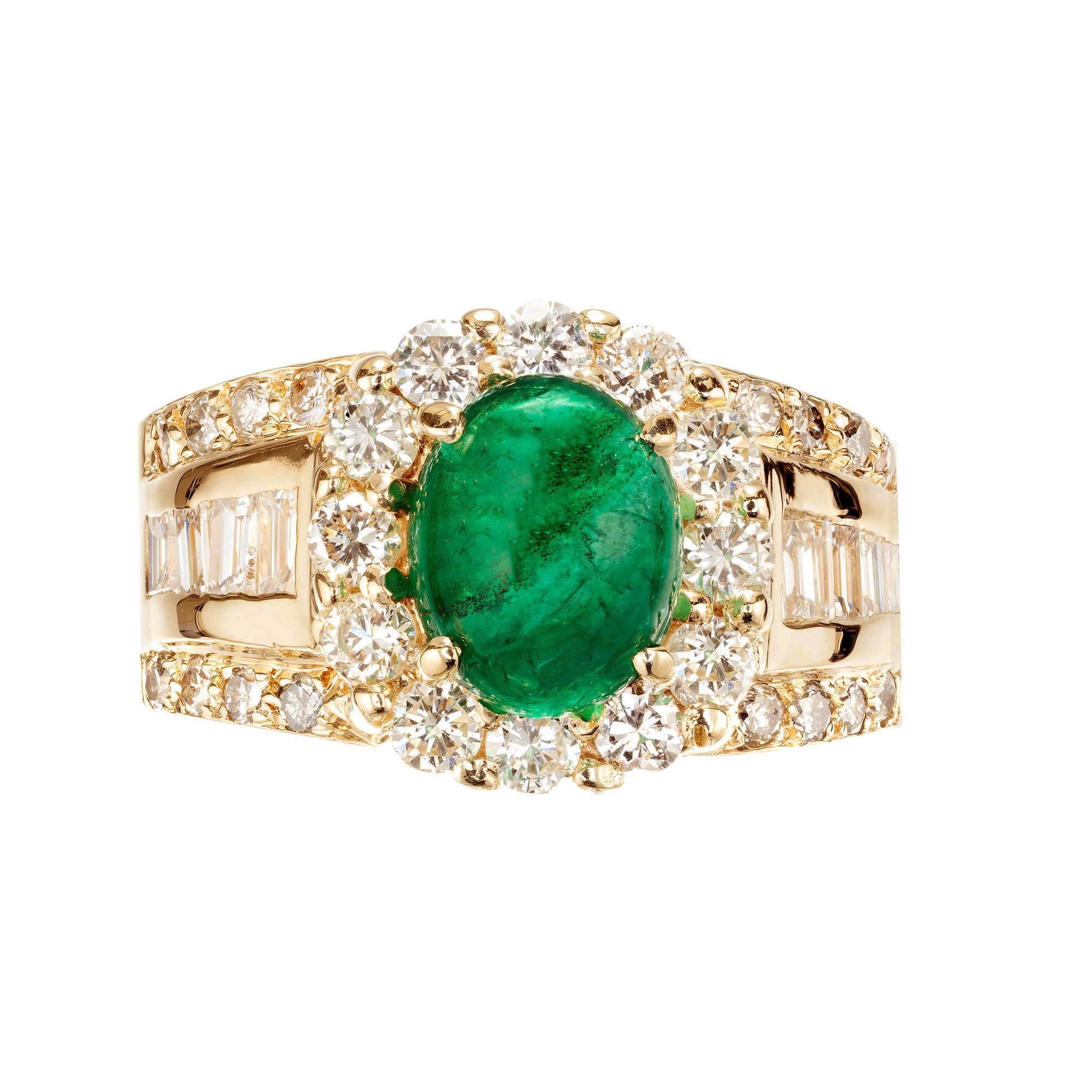 GIA certified natural cabochon green emerald and diamond cocktail ring. Oval emerald center stone, surrounded by round and baguette diamonds in a 14k yellow gold setting. 

1 oval cabochon green emerald, Approximate 2.00 Carats. Gia certificate #