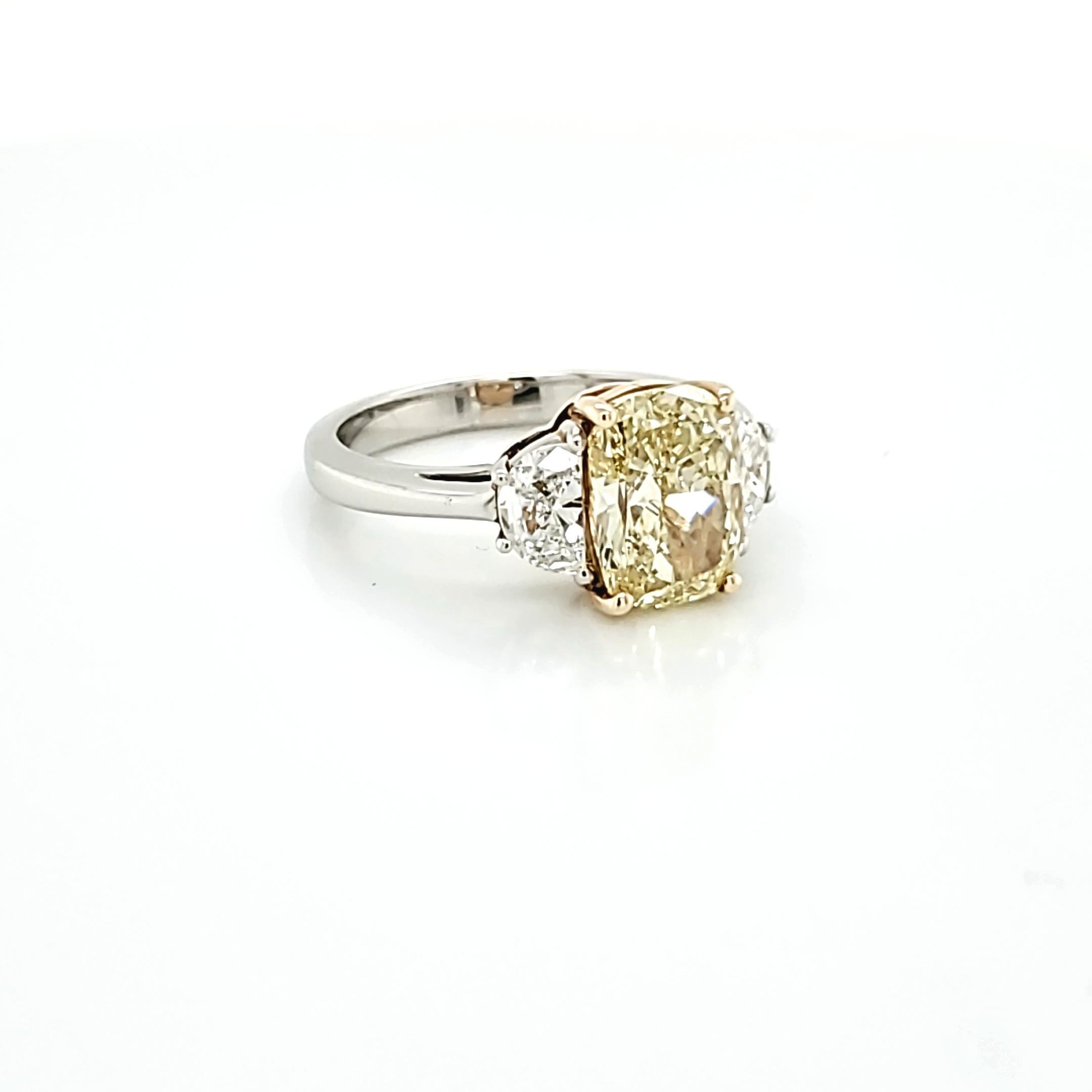 Women's or Men's GIA Certified 2.80 Carat Fancy Yellow Cushion Cut Diamond Three-Stone Ring For Sale