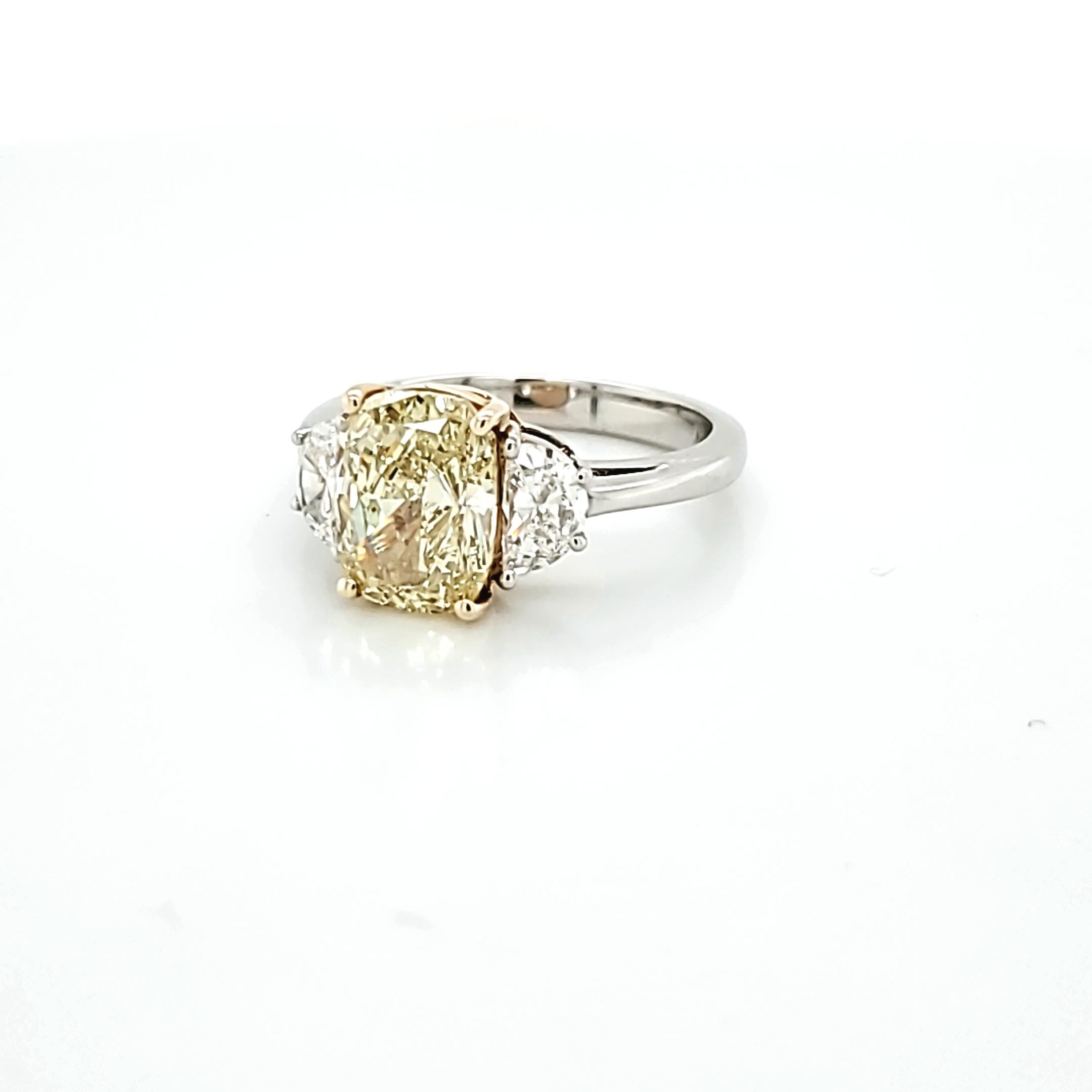 GIA Certified 2.80 Carat Fancy Yellow Cushion Cut Diamond Three-Stone Ring For Sale 1