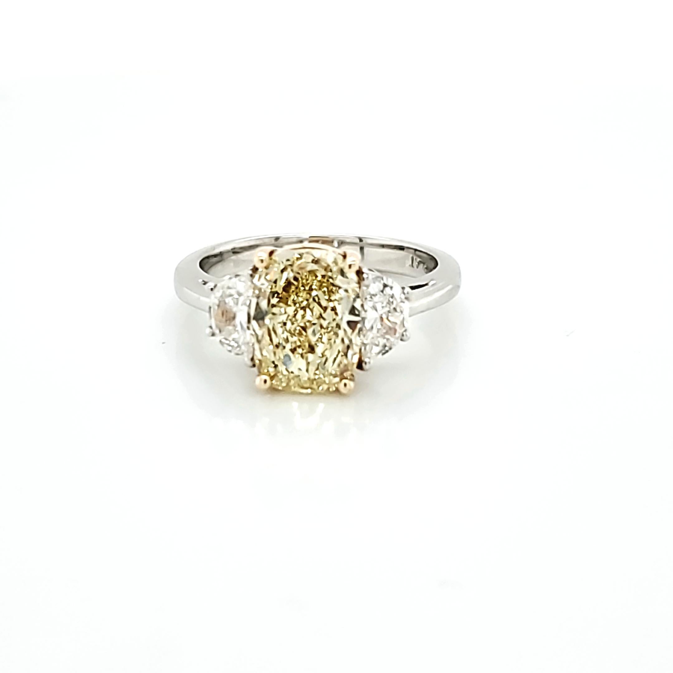 GIA Certified 2.80 Carat Fancy Yellow Cushion Cut Diamond Three-Stone Ring For Sale 3