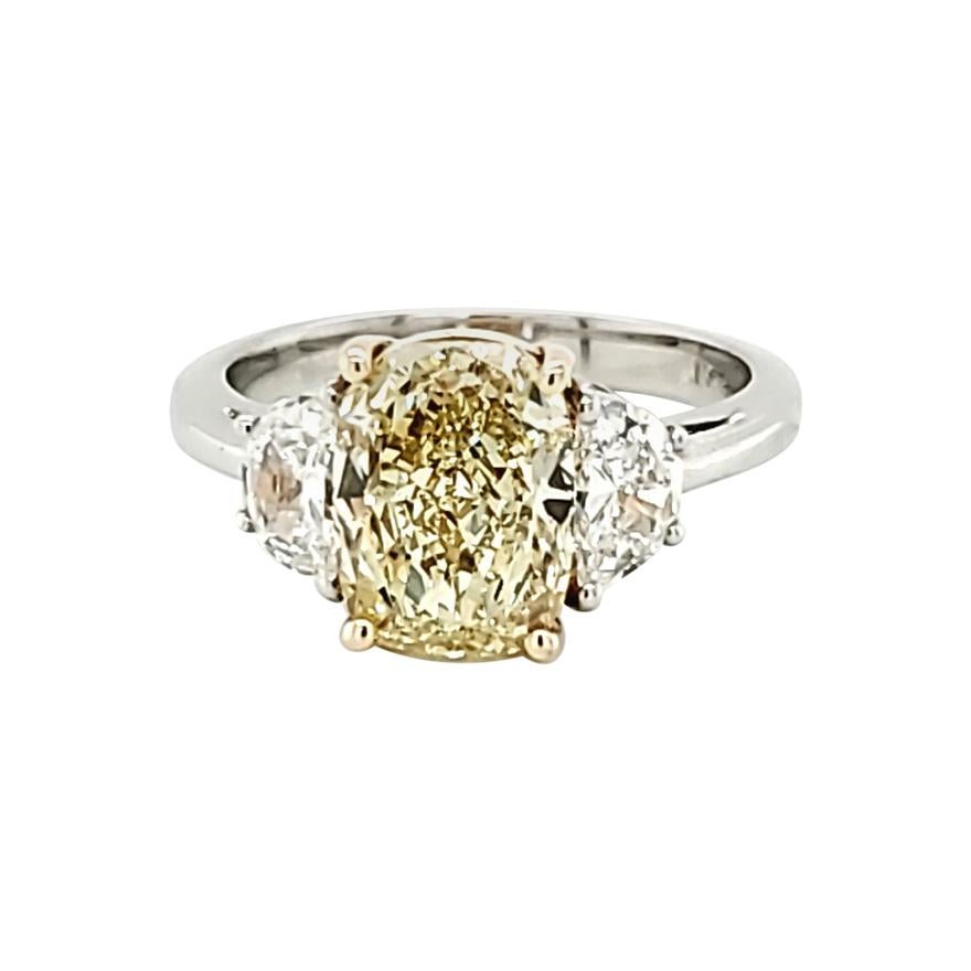GIA Certified 2.80 Carat Fancy Yellow Cushion Cut Diamond Three-Stone Ring