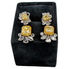 GIA Certified 2.87 Carats Fancy Yellow Diamond Earrings in 18k White Gold