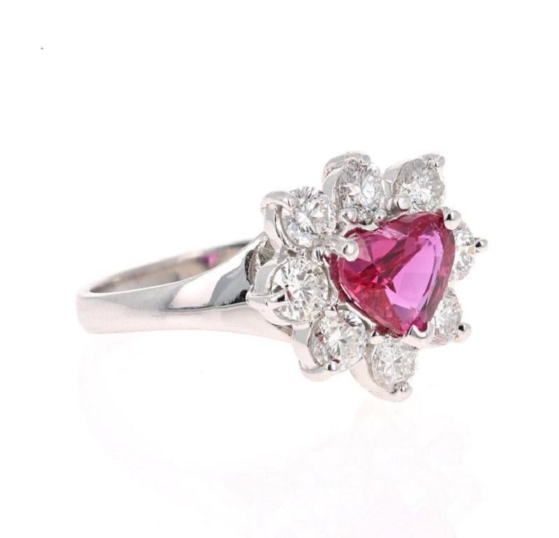 This ring has a stunning Heart Cut GIA Certified Ruby that weighs 1.72 carats. There are 8 Round Cut Diamonds that weigh 1.17 Carats 
(Clarity: SI Color: F) The total carat weight of the ring is 2.89 Carats. 

This ring is casted in 18K White Gold