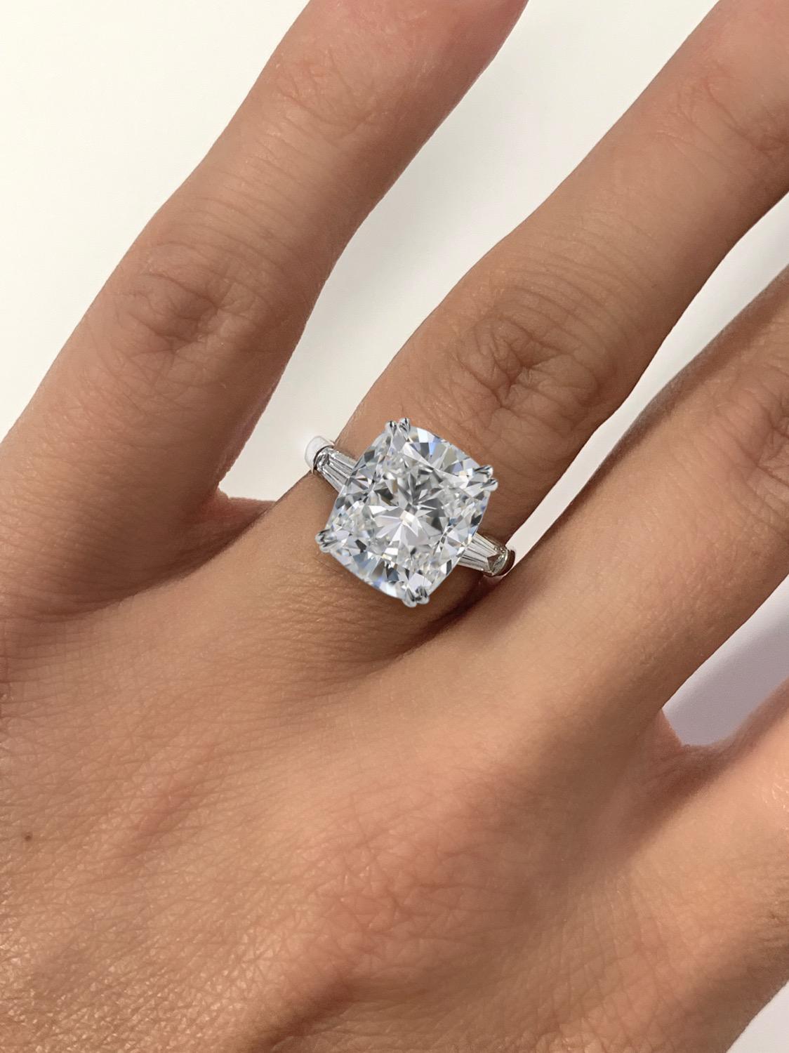Handmade in Italy this 3 carat cushion cut diamond engagement ring is stunning. The center stone has been certified by the Gemological Instute of America. The shape and cutting style is a cushion modified brilliant. It weighs 3 carats and is a g in