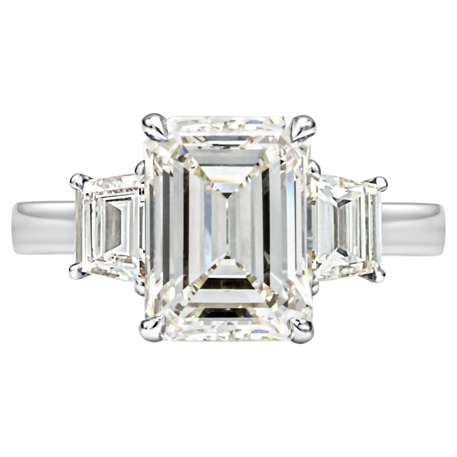 GIA Certified 2.96 Carats Emerald Cut Diamond Three-Stone Engagement Ring For Sale