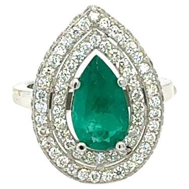 GIA Certified 2.99 Carat Double Halo Emerald Diamond 18 Karat White Gold Ring

This Emerald ring is absolutely gorgeous. The center is an Pear Cut Colombian Emerald which weighs 1.80 Carats and measures in at 11.5mm x 6.8mm.  The Emerald is