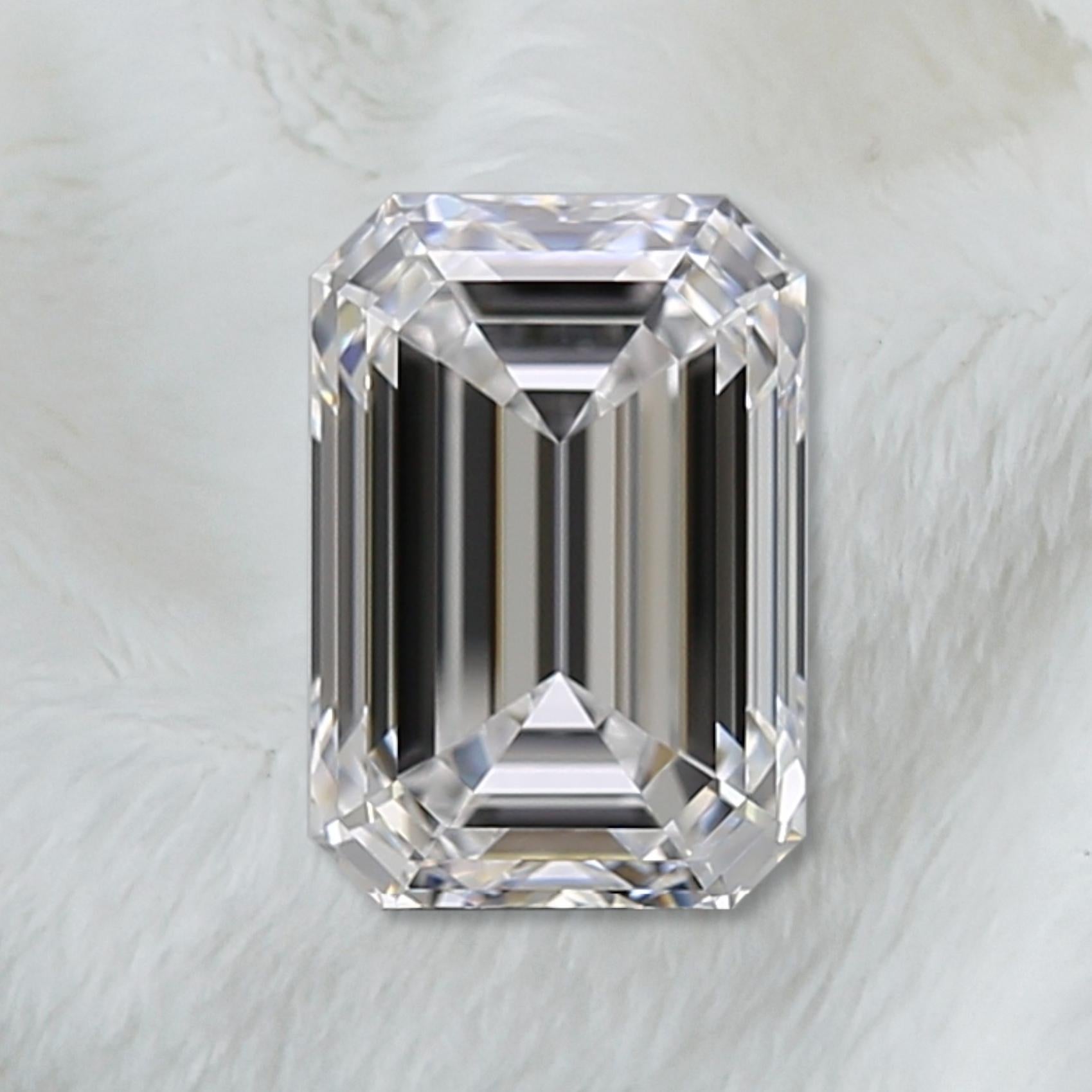 3 carat emerald cut diamond ring on finger