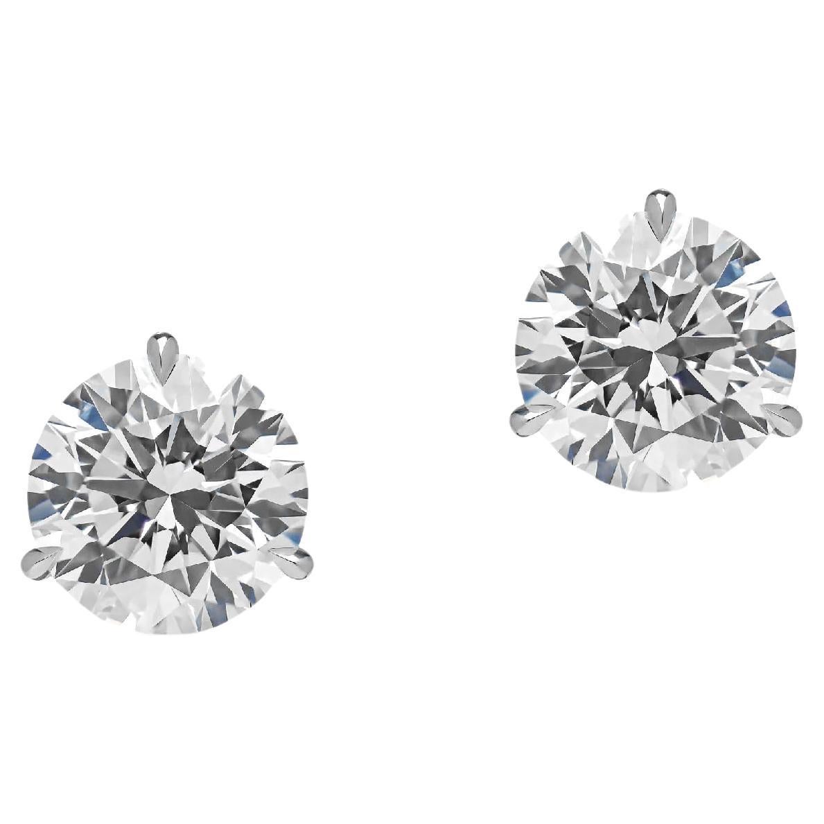 These exquisite platinum earrings showcase two GIA certified round brilliant diamonds, weighing 1.51 and 1.53 carats respectively, for a combined total of 3.04 carats.

Graded H for color, the diamonds exhibit a nearly colorless appearance with a