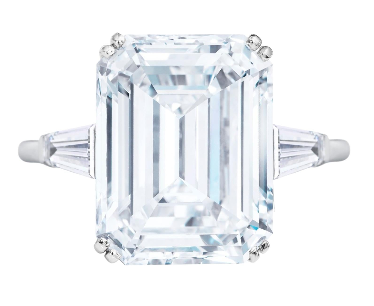 An exquisite emerald cut diamond ring composed by a main stone that weights 3 carats has an excellent proportion polish and symmetry. The side stones are tapered baguettes also very pure and white

The ring is set in 18 carats white gold

The stone