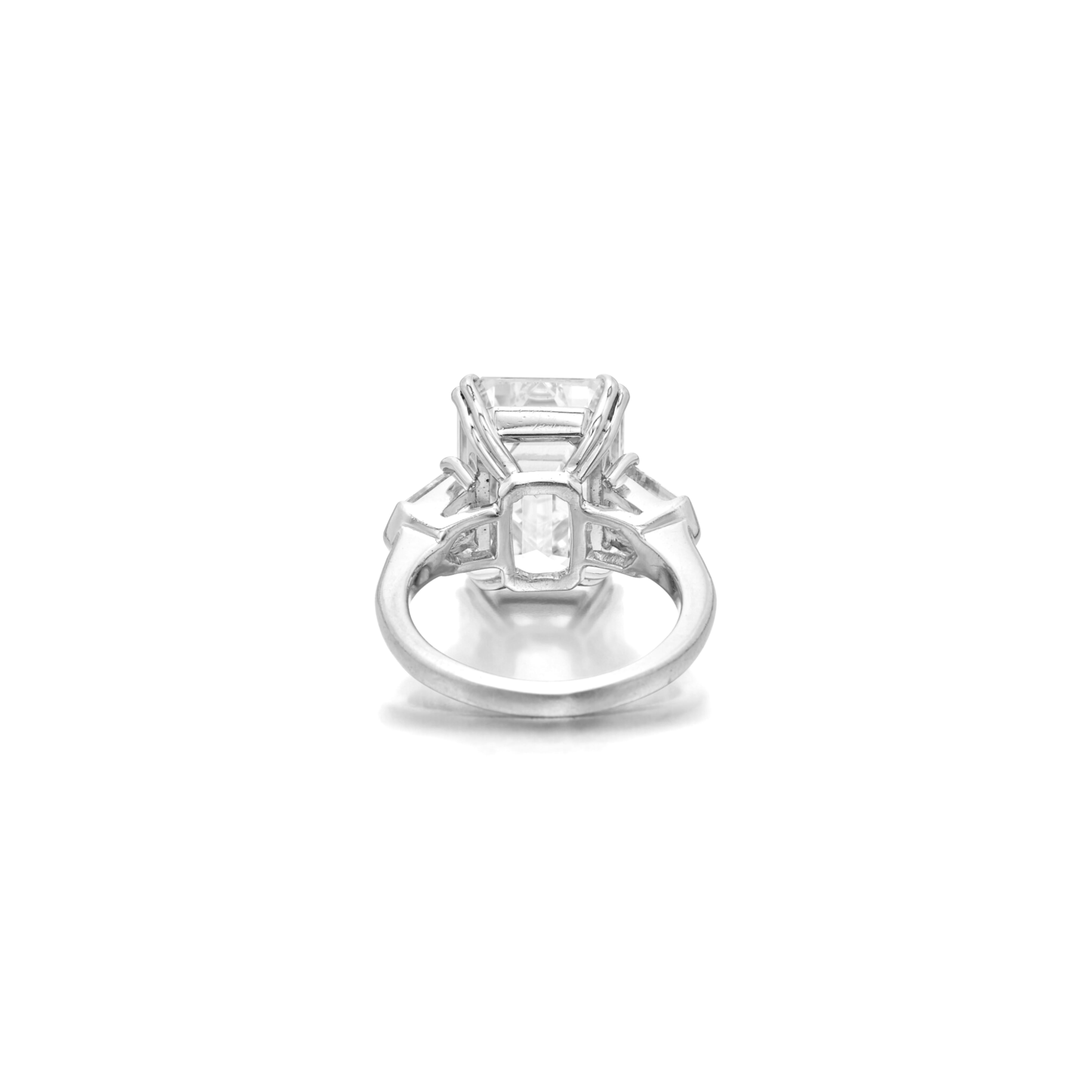 Presenting an exceptional 3-carat emerald-cut diamond ring set in platinum, accompanied by two bullet diamonds. This stunning piece is certified by GIA, ensuring the highest standards of quality and authenticity. With an D color and Flawless clarity