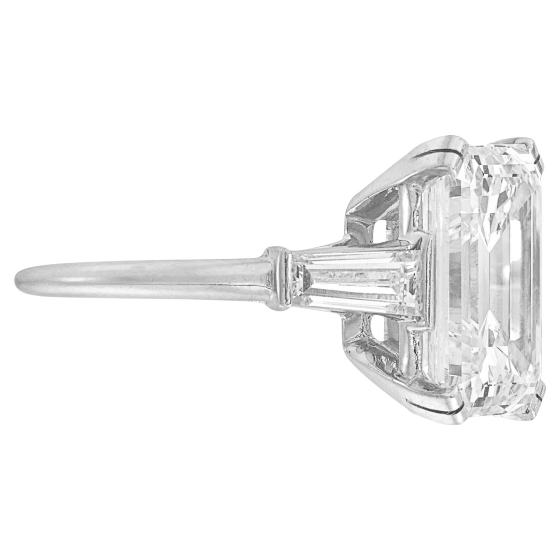 Crafted with meticulous attention to detail, this 18K White Gold Ring is the epitome of classic elegance. It features a stunning 3.02 carat emerald cut diamond, which radiates sophistication. 

With a rare gem, this D colored diamond sparkles with