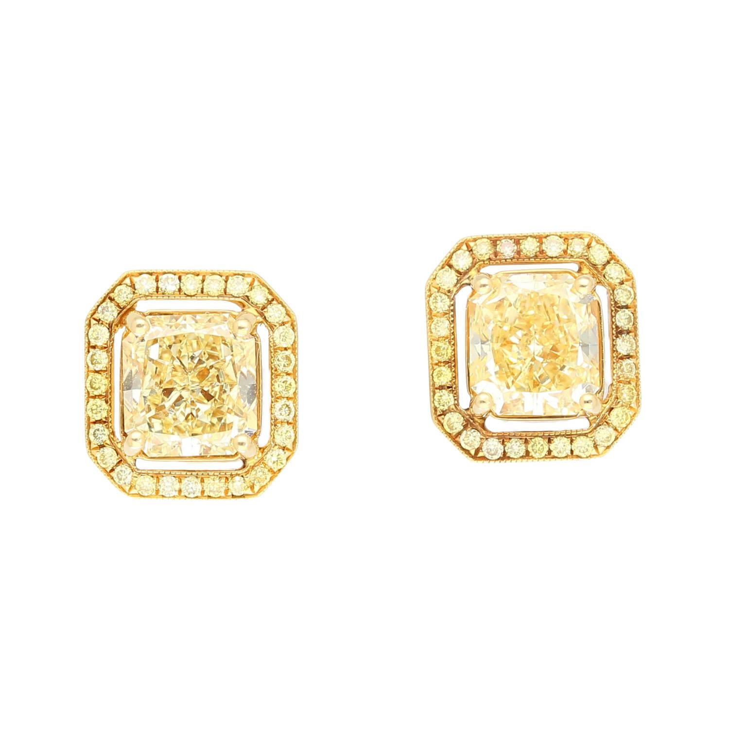 3-carat total weight fancy light yellow diamond stud earrings in 18k gold. Centering two radiant cut natural diamonds, each of which is GIA certified. The center stones feature a mesmerizing 1.50-carat internally flawless (IF) clarity and 1.42-carat