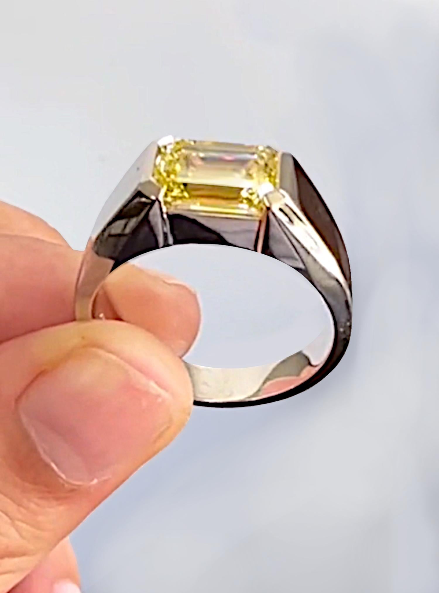 Modern GIA Certified 3 Carat Fancy Yellow Emerald Cut Band Ring For Sale