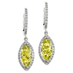 GIA Certified 3 Carat Fancy Yellow Marquise Diamond Earrings.