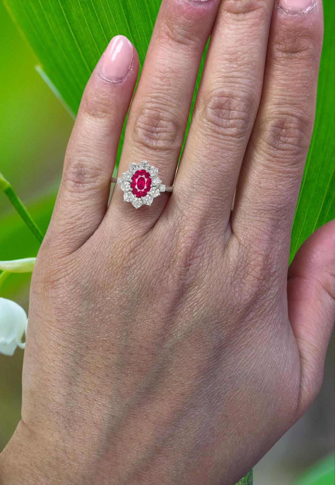This spectacular oval ruby engagement ring features a magnificent, 2 carat pure red ruby. This world class gem is a beautifully symmetrical oval with ideal color and exceptional brilliance and life. 

It is accompanied by Gemological Institute of