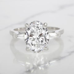 GIA Certified 3.01 Carat Oval Diamond D Color Ring with tapered baguette