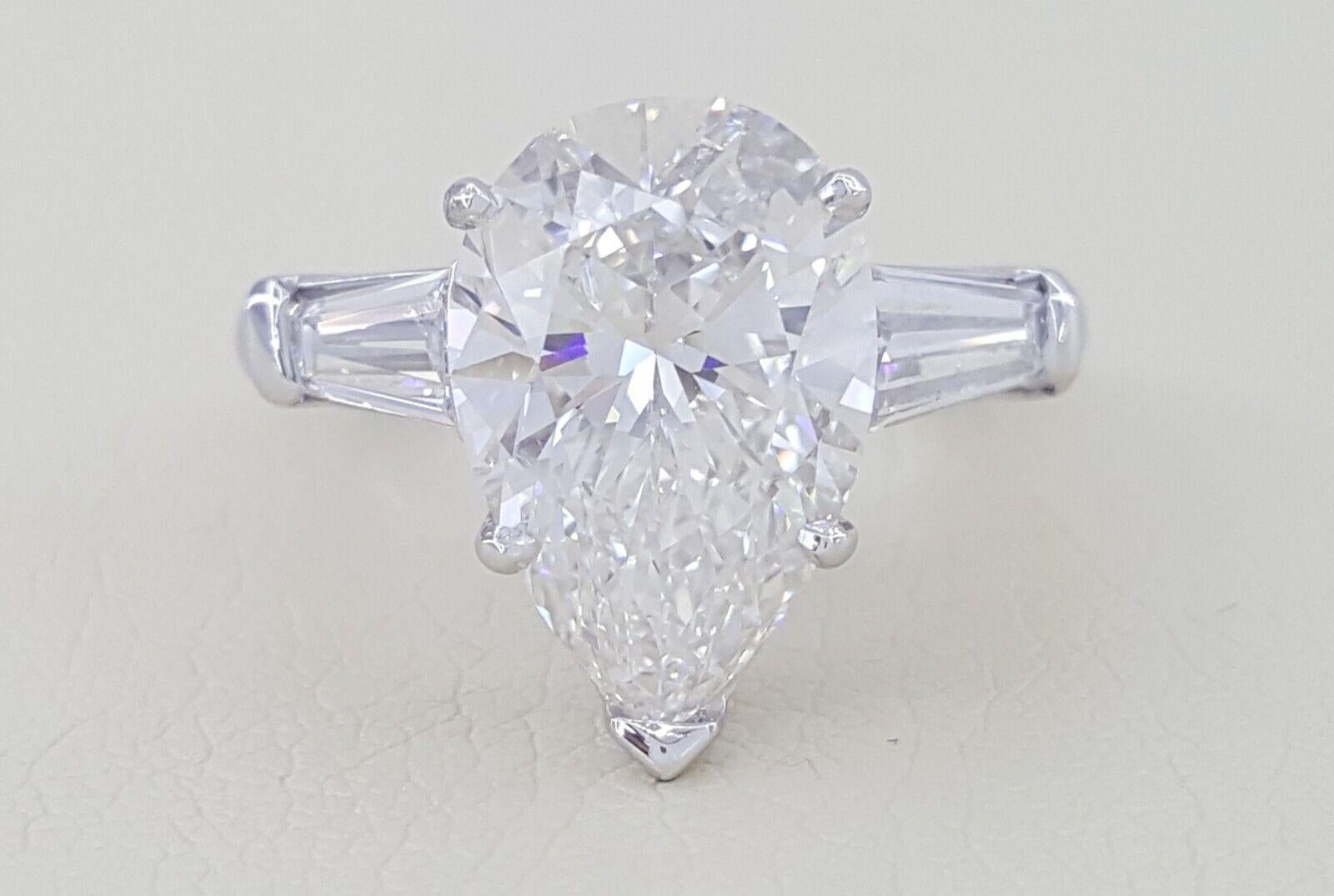 This exquisite ring showcases a GIA-certified 2.00 Carat pear cut diamond, set in a sleek 18K white gold band. 

The diamond boasts a G color grade, offering the highest level of whiteness and brilliance.
With an exceptional lack of imperfections,