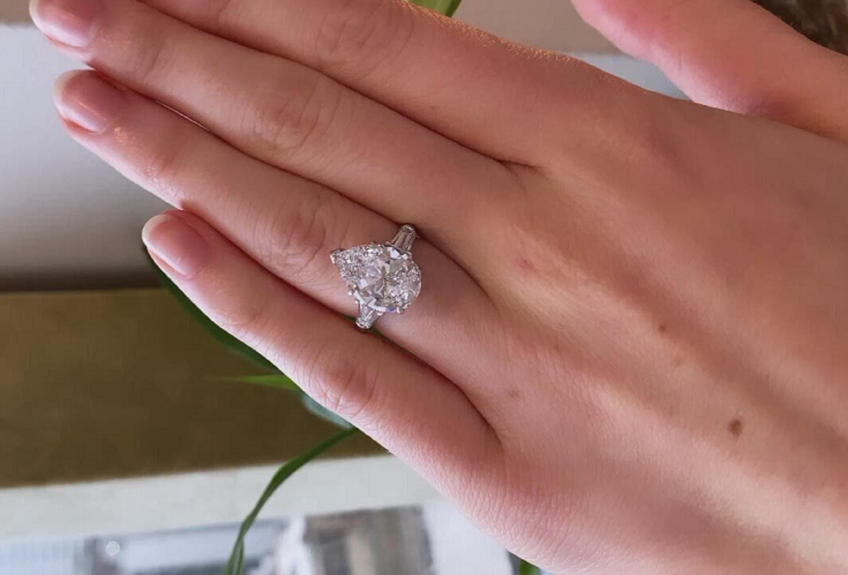 3 carat pear shaped diamond ring on hand