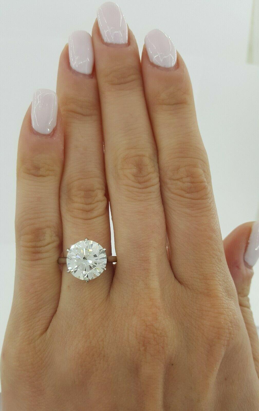 An exquisite round brilliant cut diamond GIA Certified 4 Carat Round Brilliant Cut Diamond Platinum Ring 
