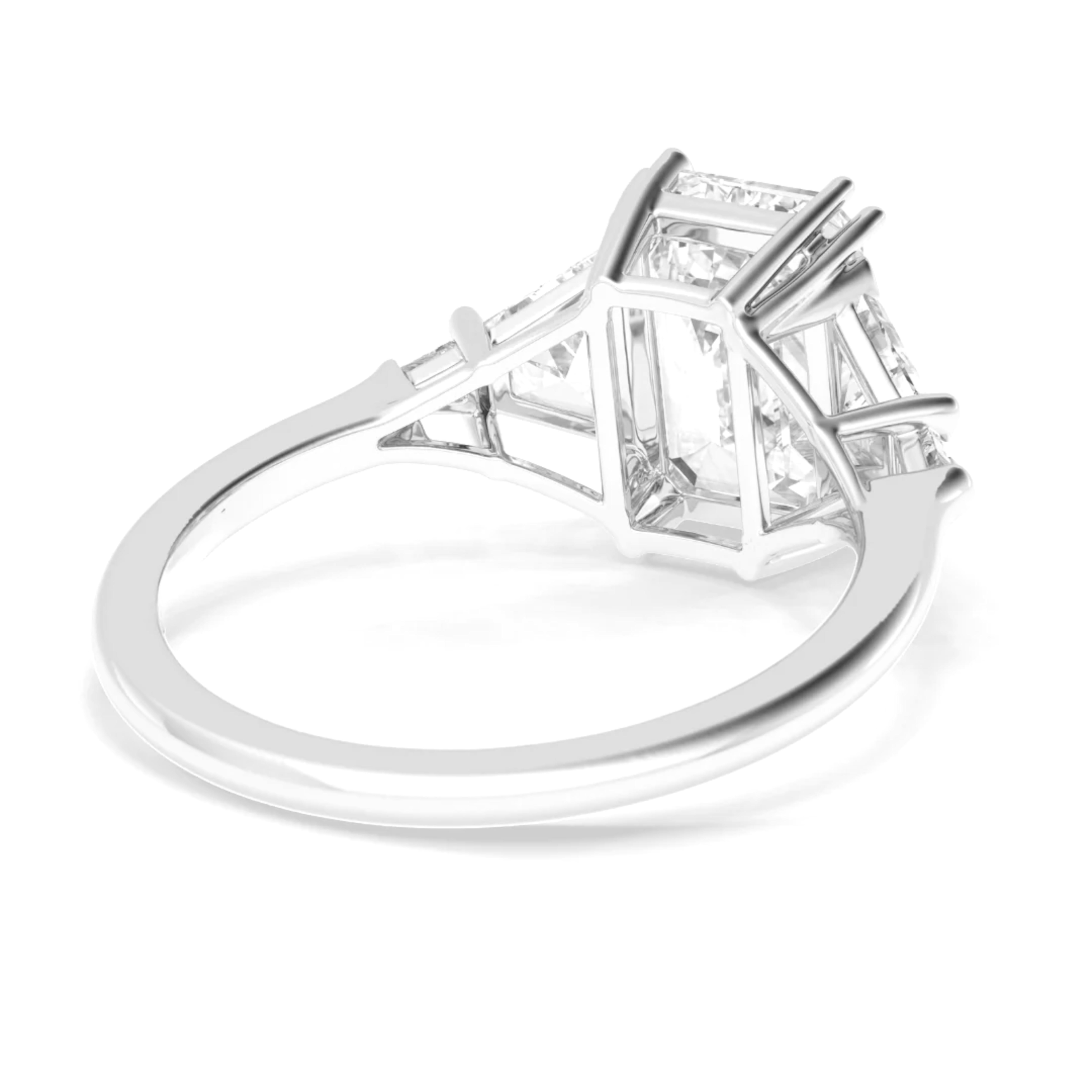 Elegante y atemporal, este anillo de diamantes talla esmeralda de 3,00 quilates con certificado GIA es una impresionante expresión de lujo refinado. Engastado en elegante platino y acentuado con diamantes laterales en forma de media luna cónica,